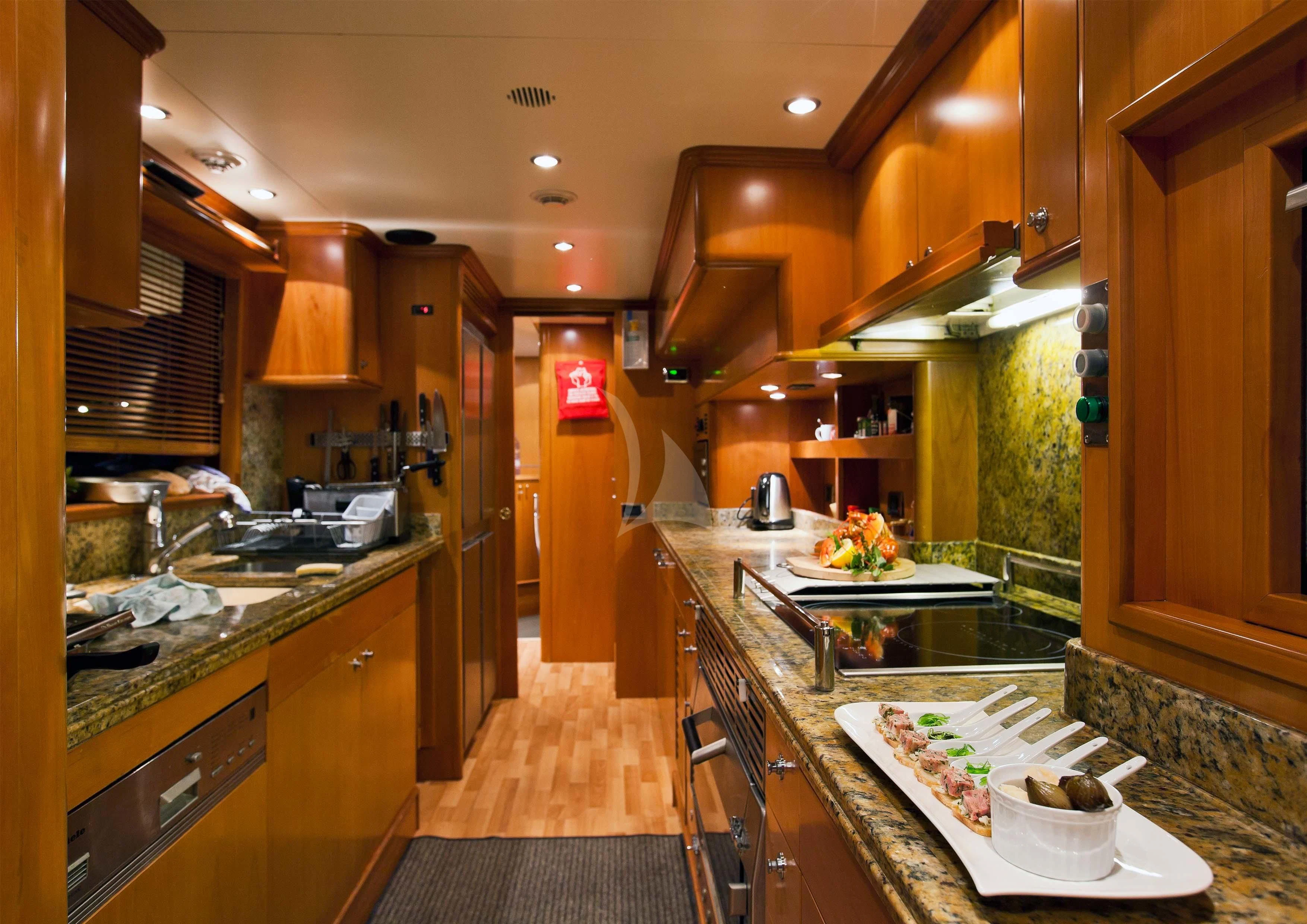 a kitchen with a large island aboard NEW STAR Yacht for Charter