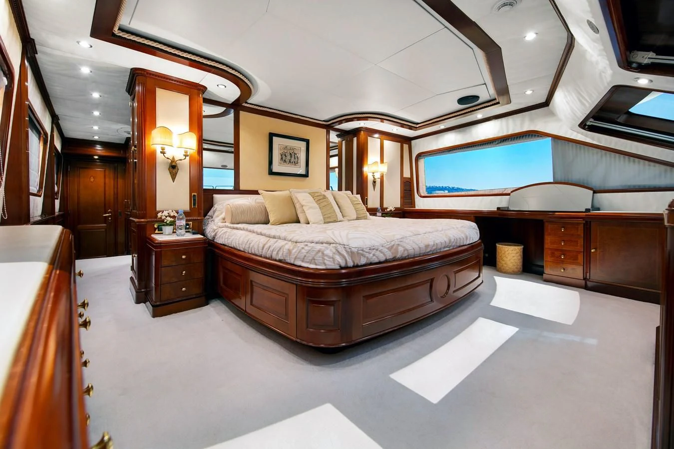 a bedroom with a bed and a tv aboard NEW STAR Yacht for Charter
