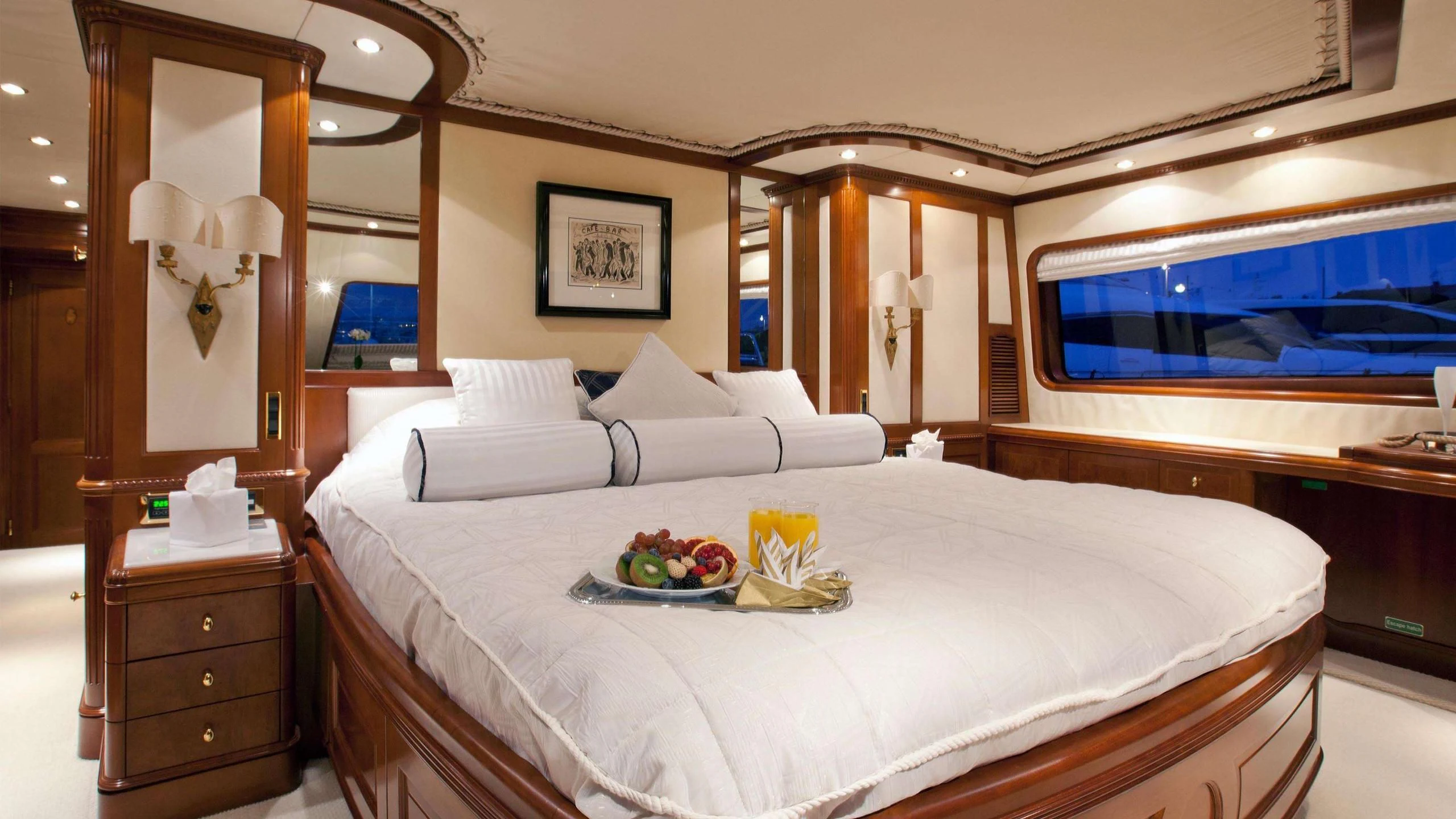 a bed with a television on the wall aboard NEW STAR Yacht for Charter