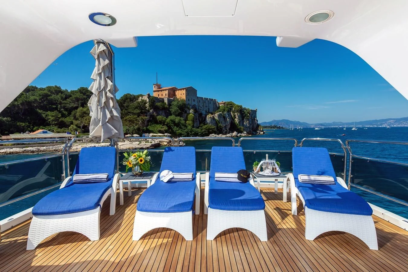 a deck with chairs and tables on it aboard NEW STAR Yacht for Charter