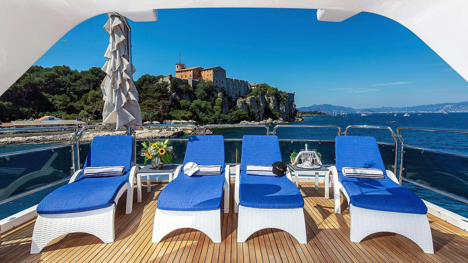 a pool with chairs and tables aboard NEW STAR Yacht for Charter