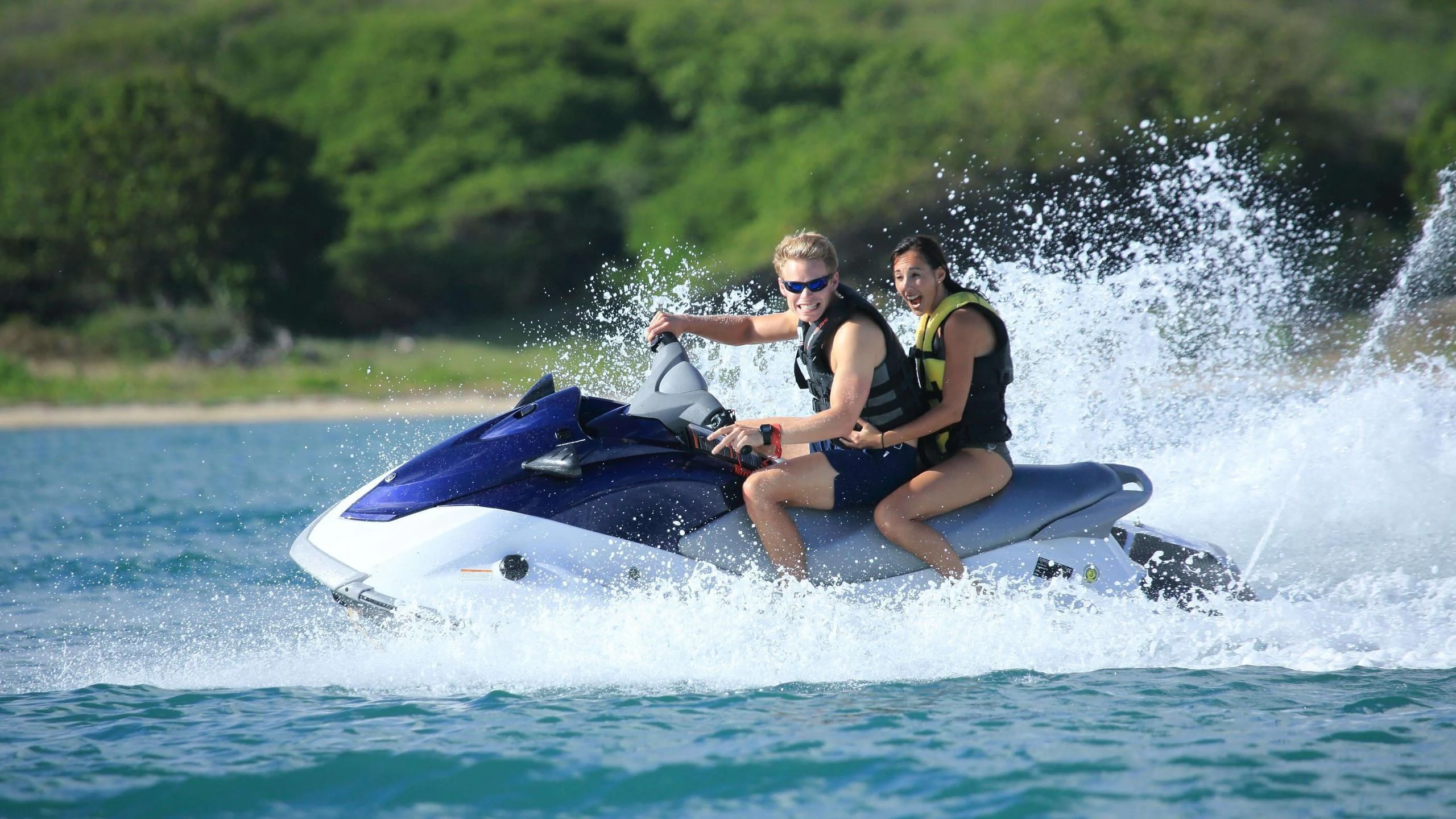a couple of people on a jet ski aboard NEW STAR Yacht for Charter