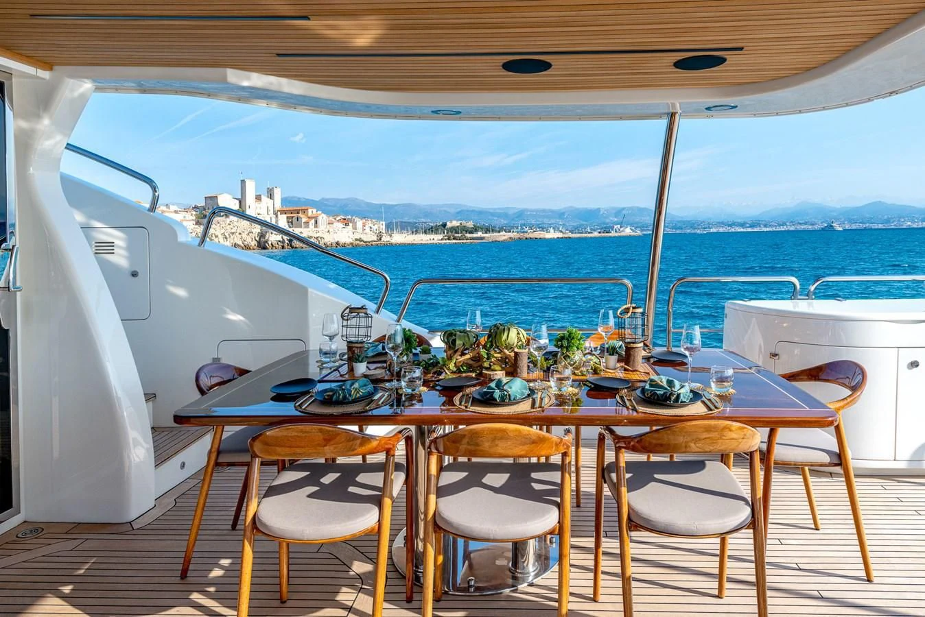 a table set for a meal on a boat aboard NEW STAR Yacht for Charter