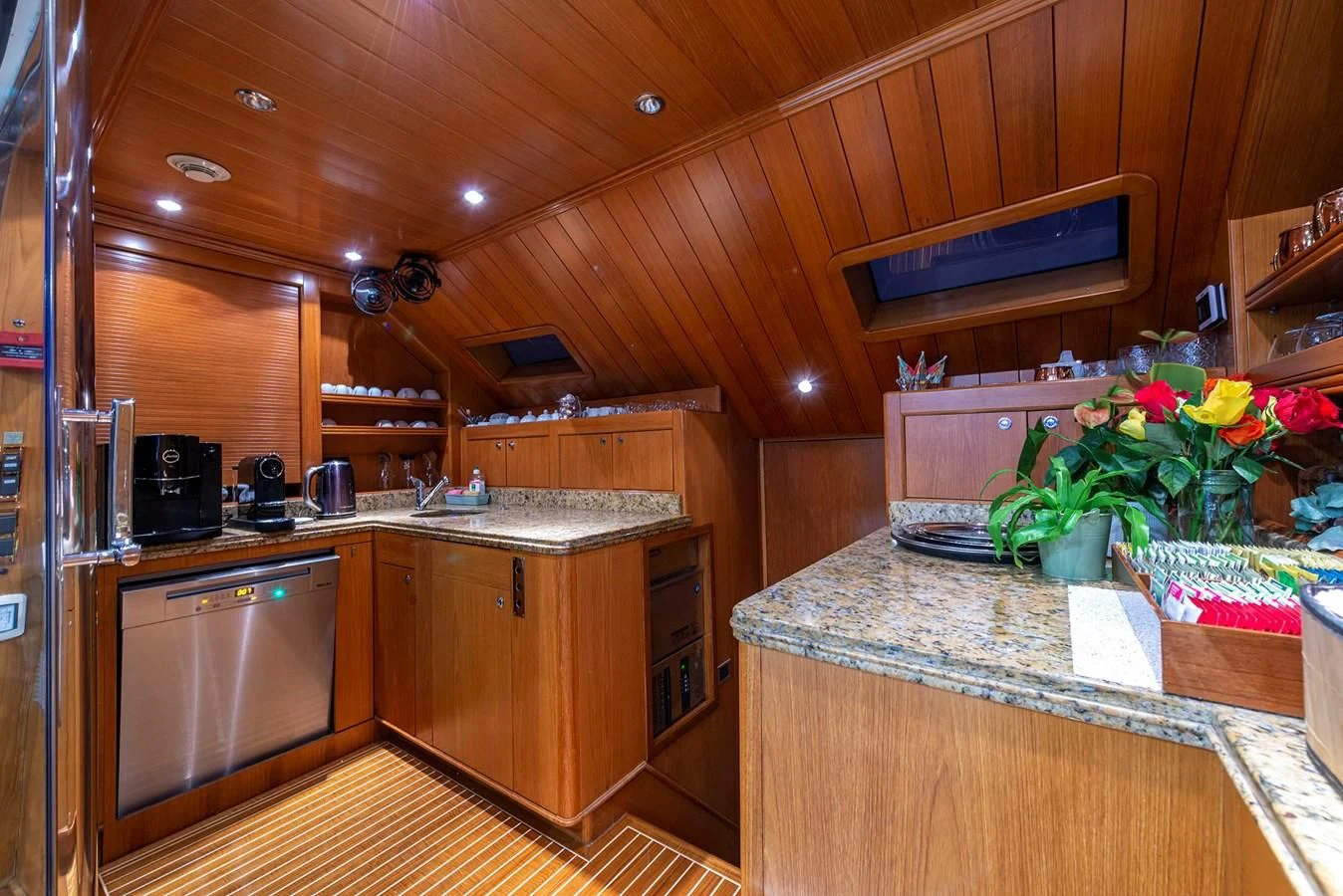 a kitchen with wooden cabinets aboard NEW STAR Yacht for Charter
