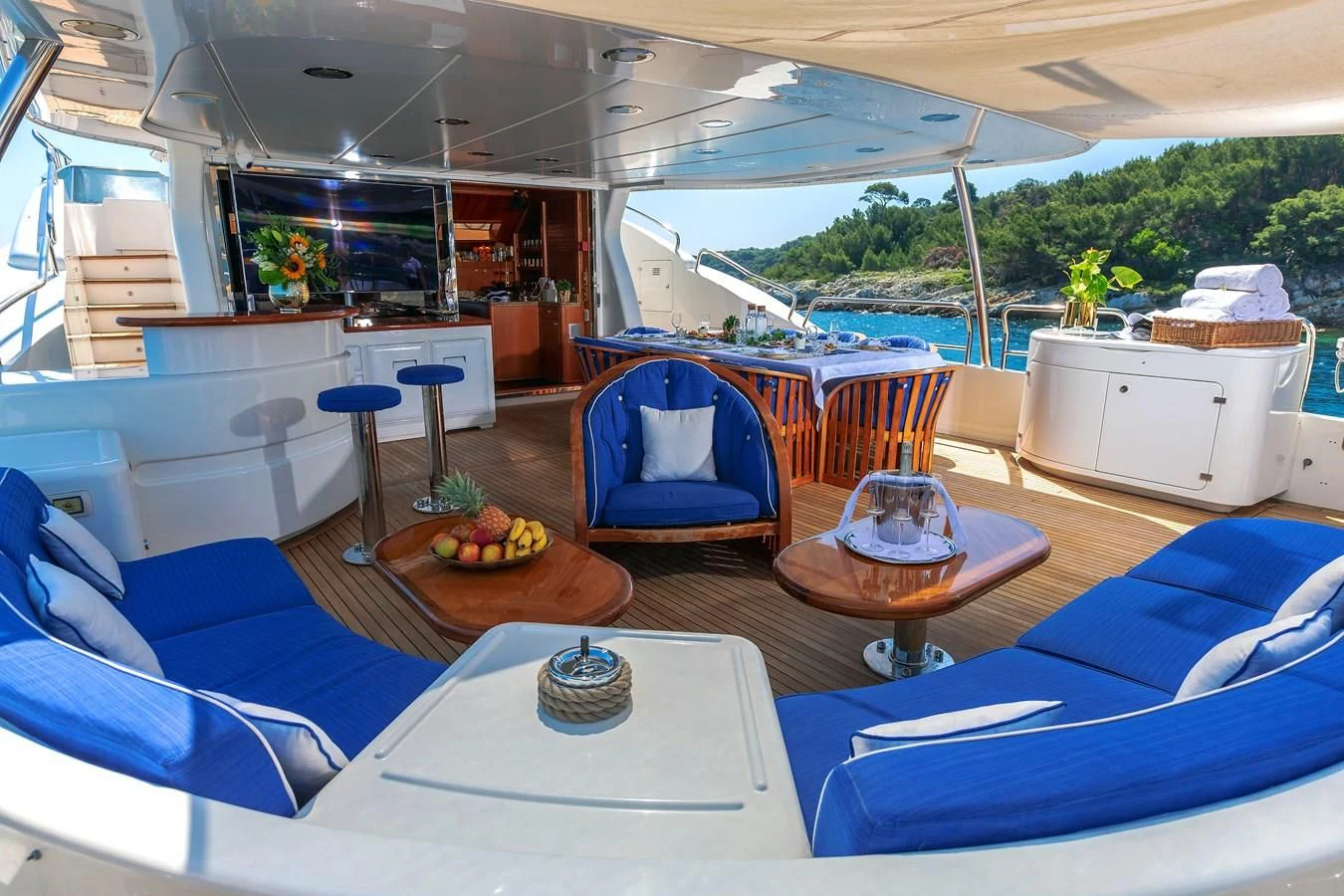 a boat with a table and chairs aboard NEW STAR Yacht for Charter