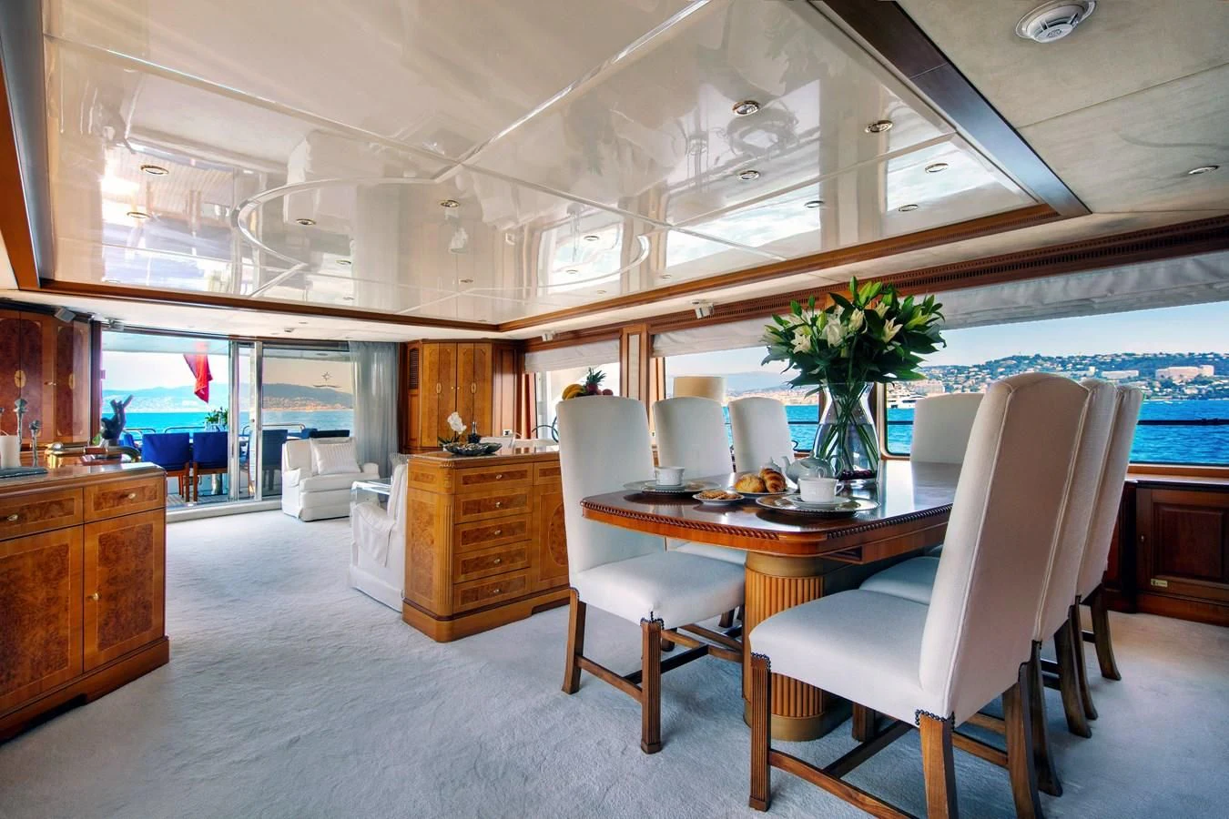 a room with a table and chairs aboard NEW STAR Yacht for Charter