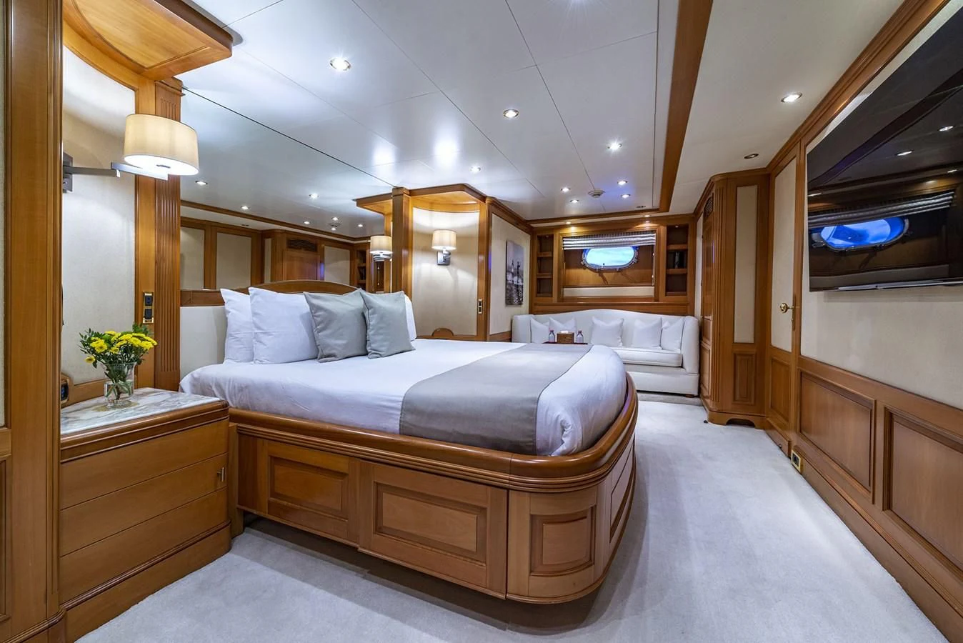 a bedroom with a bed and a desk aboard NEW STAR Yacht for Charter