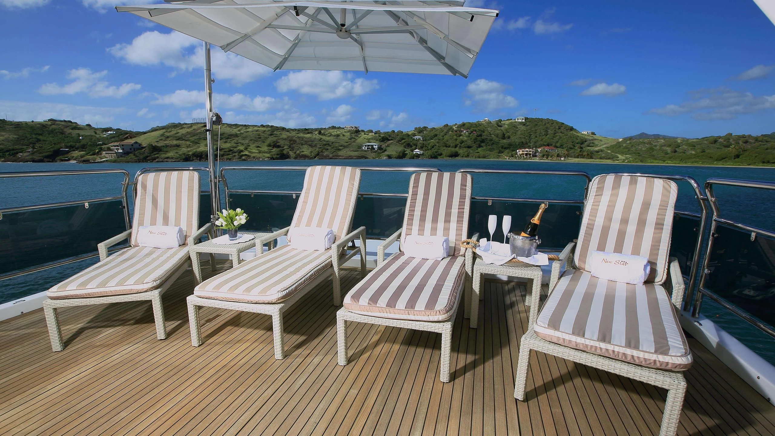 a deck with chairs and tables on it aboard NEW STAR Yacht for Charter