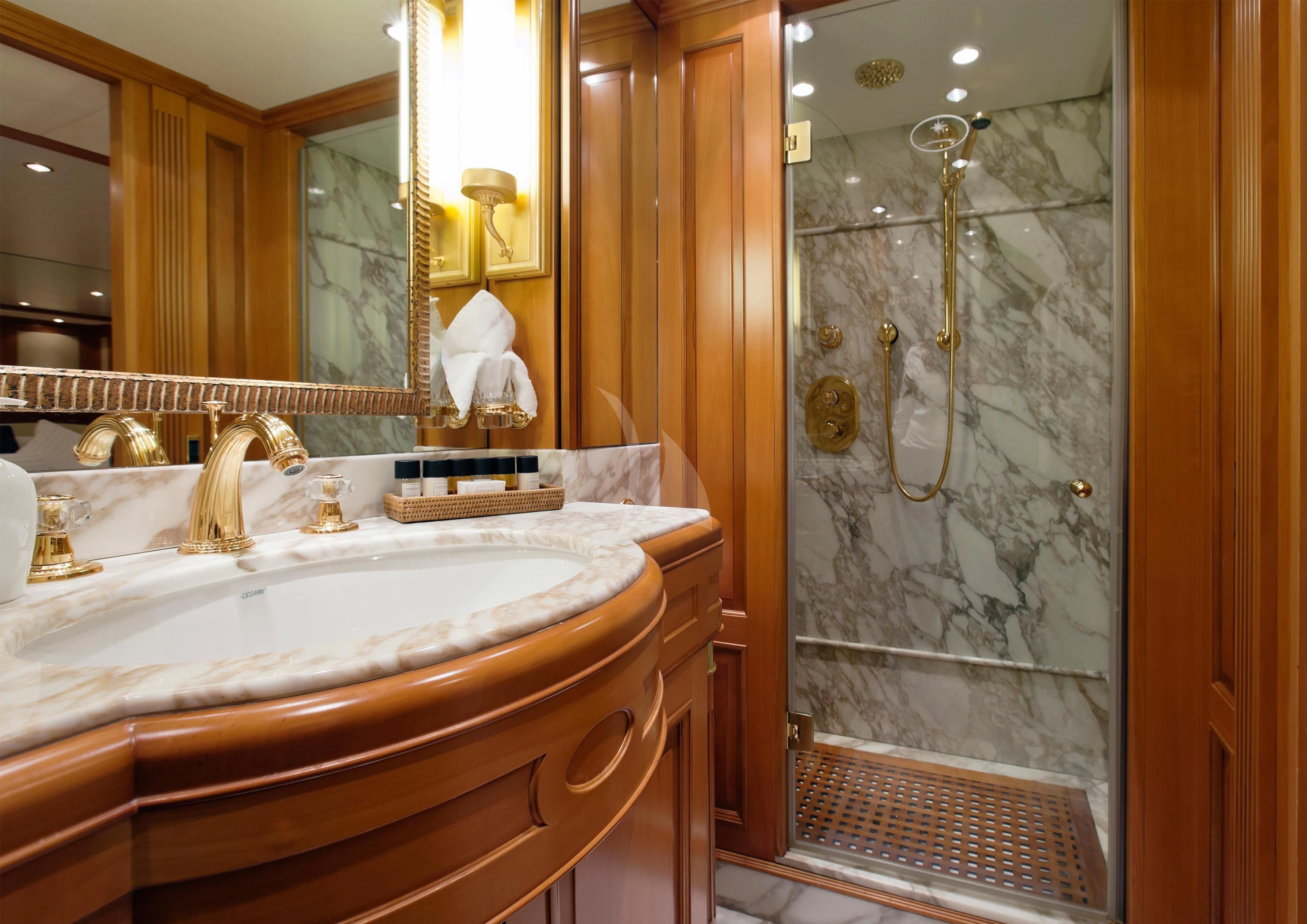 a bathroom with a glass shower aboard NEW STAR Yacht for Charter