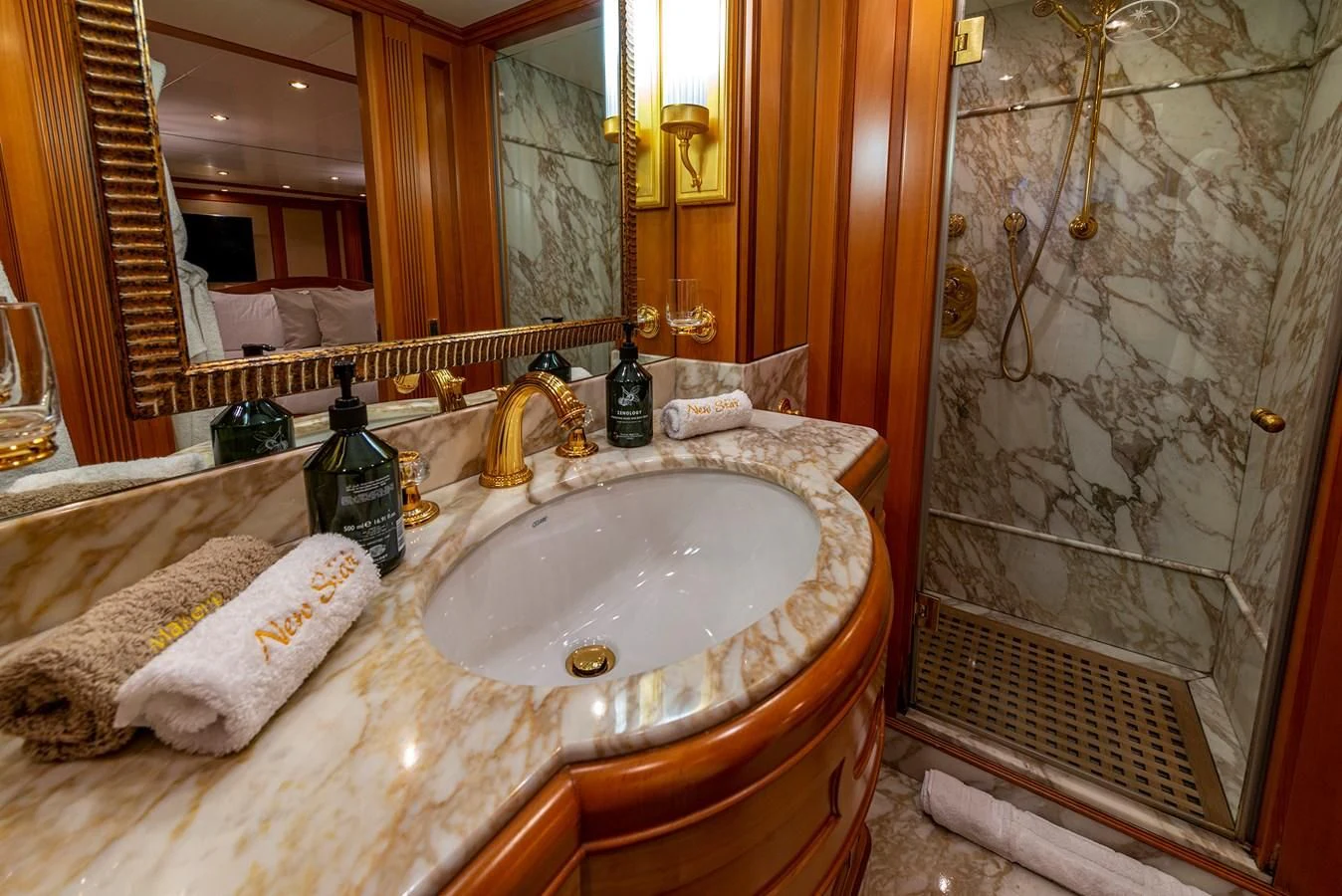 a bathroom with a sink and a shower aboard NEW STAR Yacht for Charter
