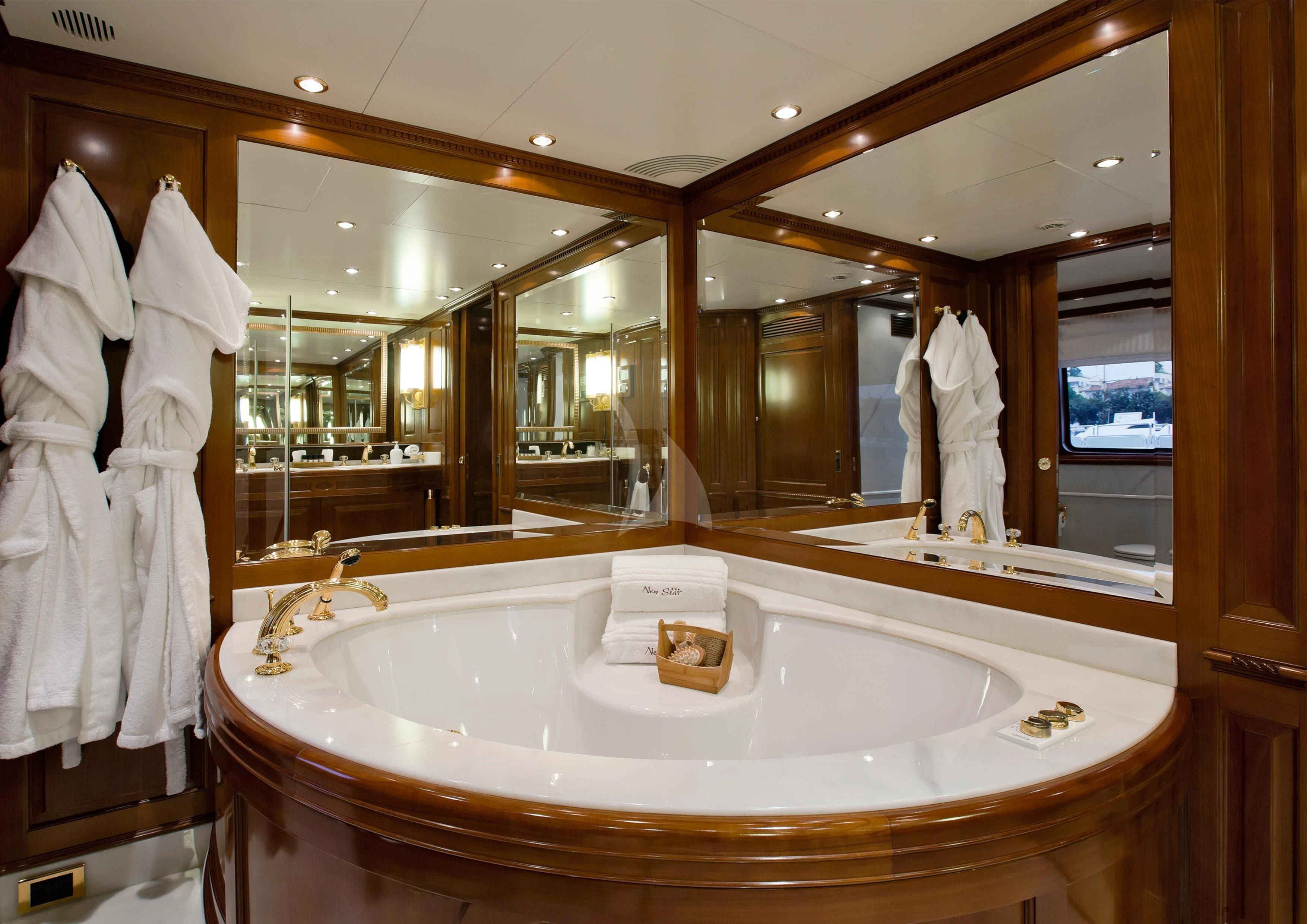 a bathroom with a large mirror aboard NEW STAR Yacht for Charter