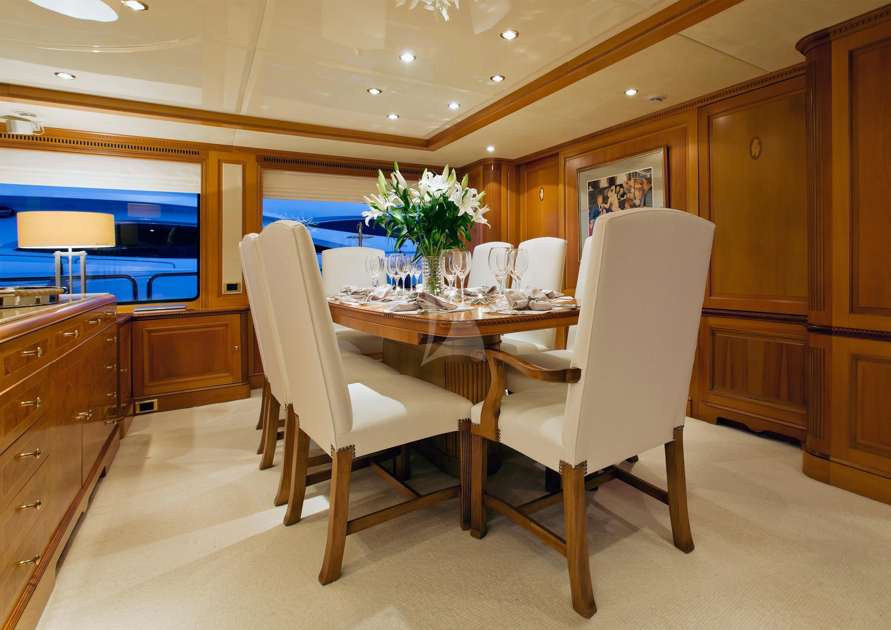 a dining room with a table and chairs aboard NEW STAR Yacht for Charter