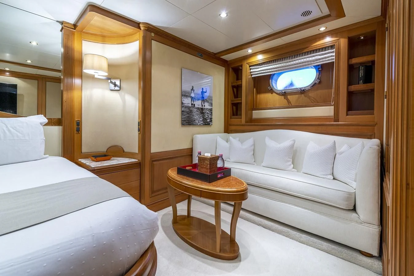 a room with a bed and a table aboard NEW STAR Yacht for Charter