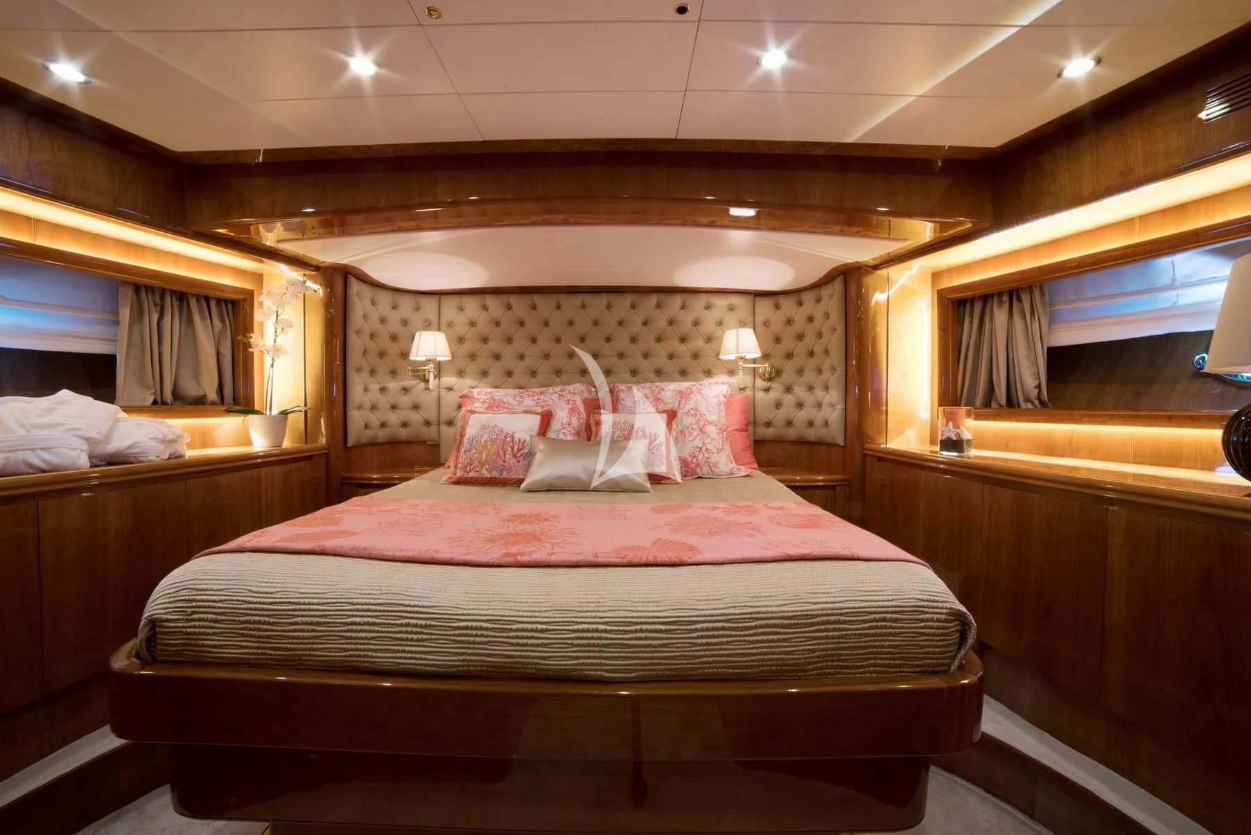 a bed with pink sheets aboard D'ARISTOTELIS Yacht for Sale