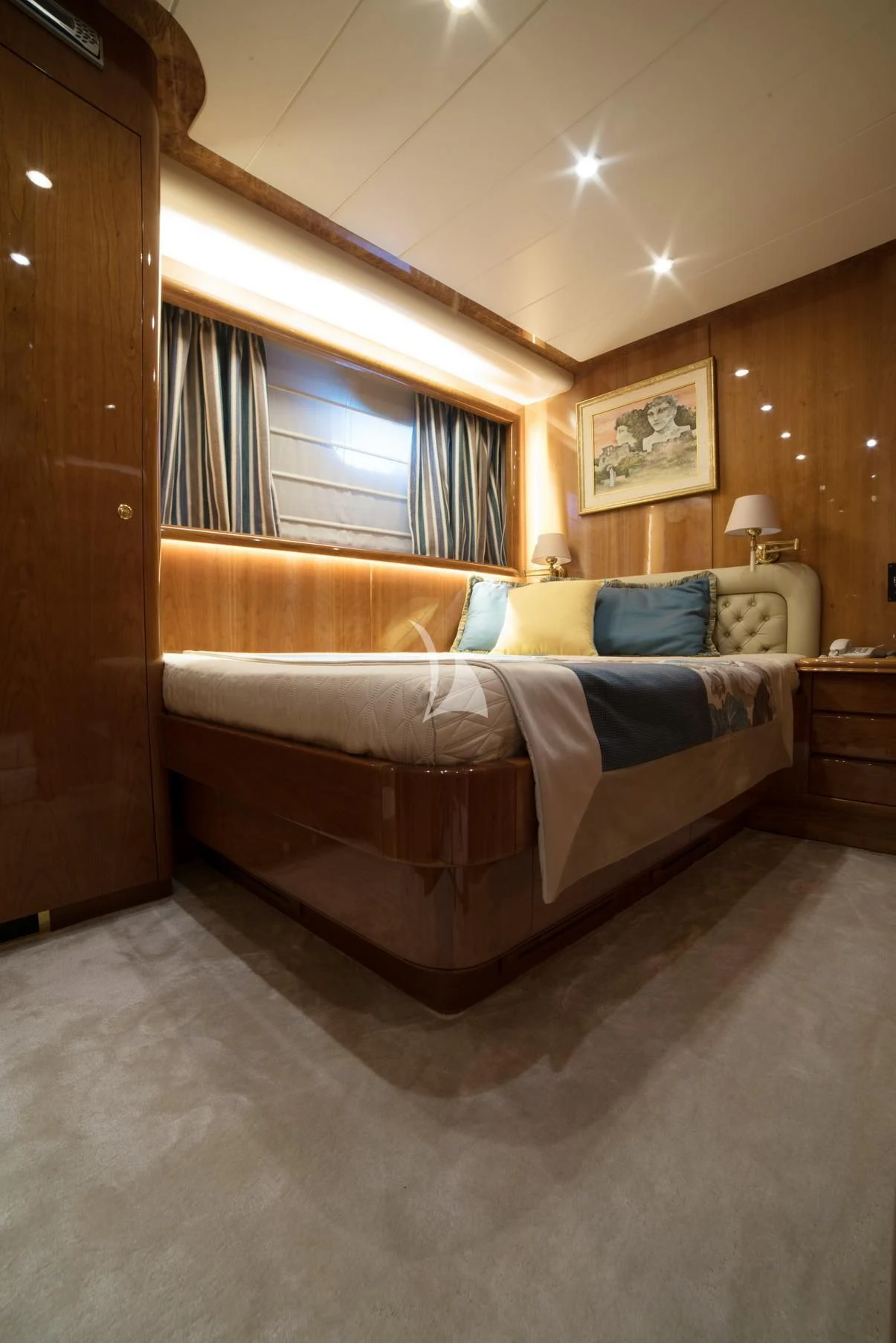 a bedroom with a bed and a window aboard D'ARISTOTELIS Yacht for Sale