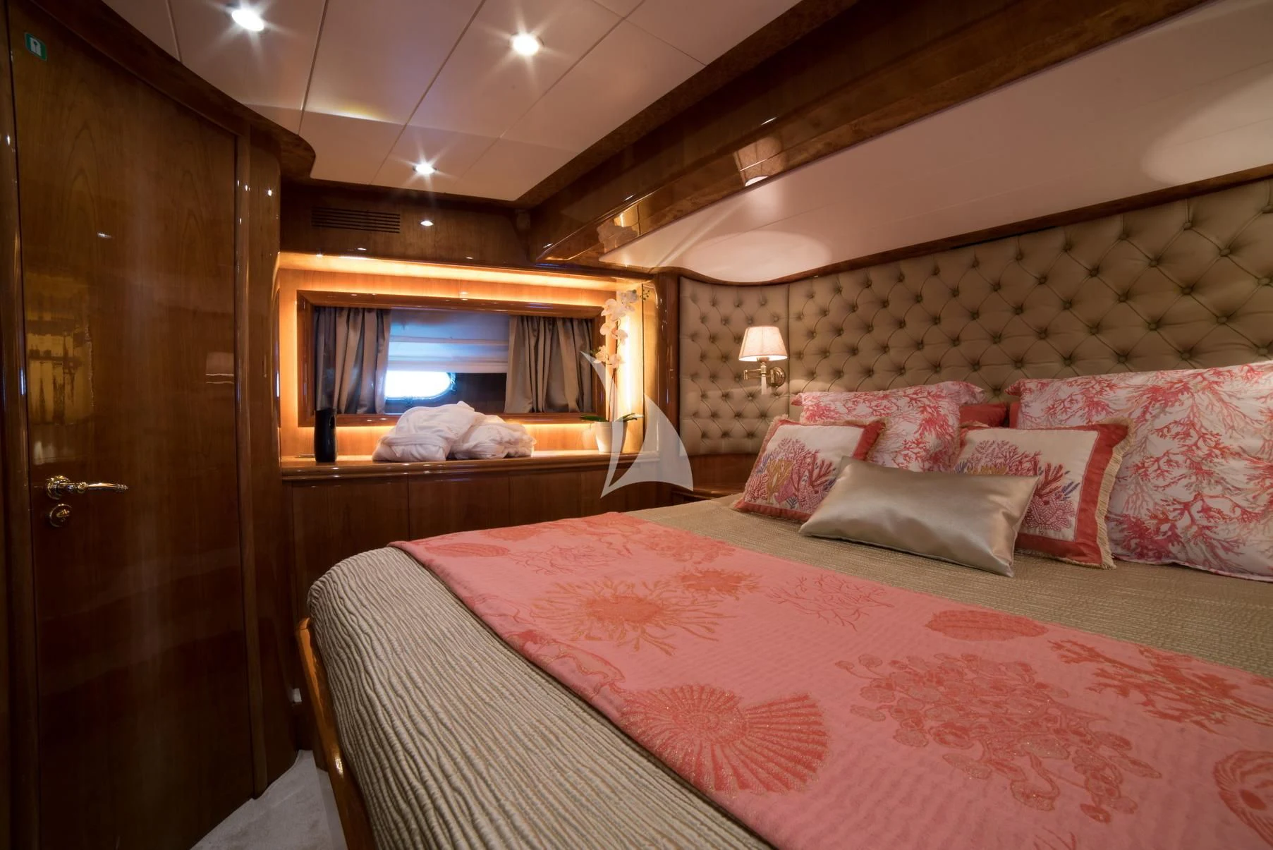 a bed with pink sheets aboard D'ARISTOTELIS Yacht for Sale