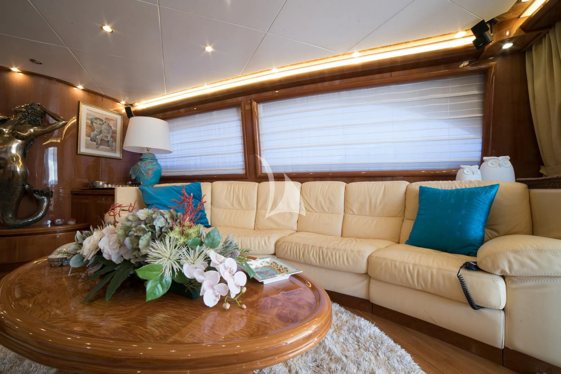 a living room with a couch and a table aboard D'ARISTOTELIS Yacht for Sale