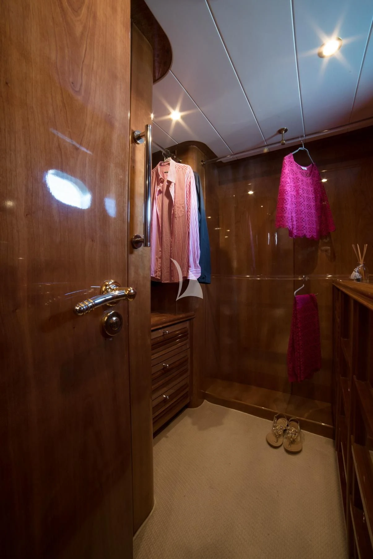 a bathroom with a closet and a mirror aboard D'ARISTOTELIS Yacht for Sale