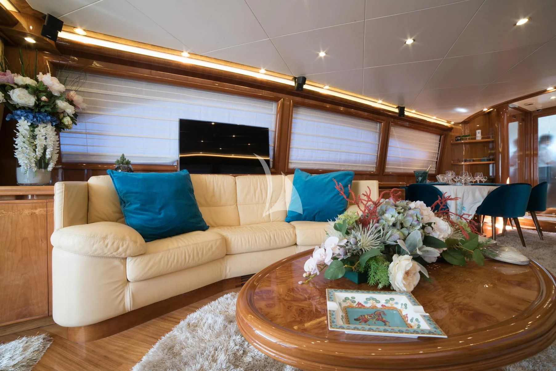 a living room with a couch and flowers aboard D'ARISTOTELIS Yacht for Sale