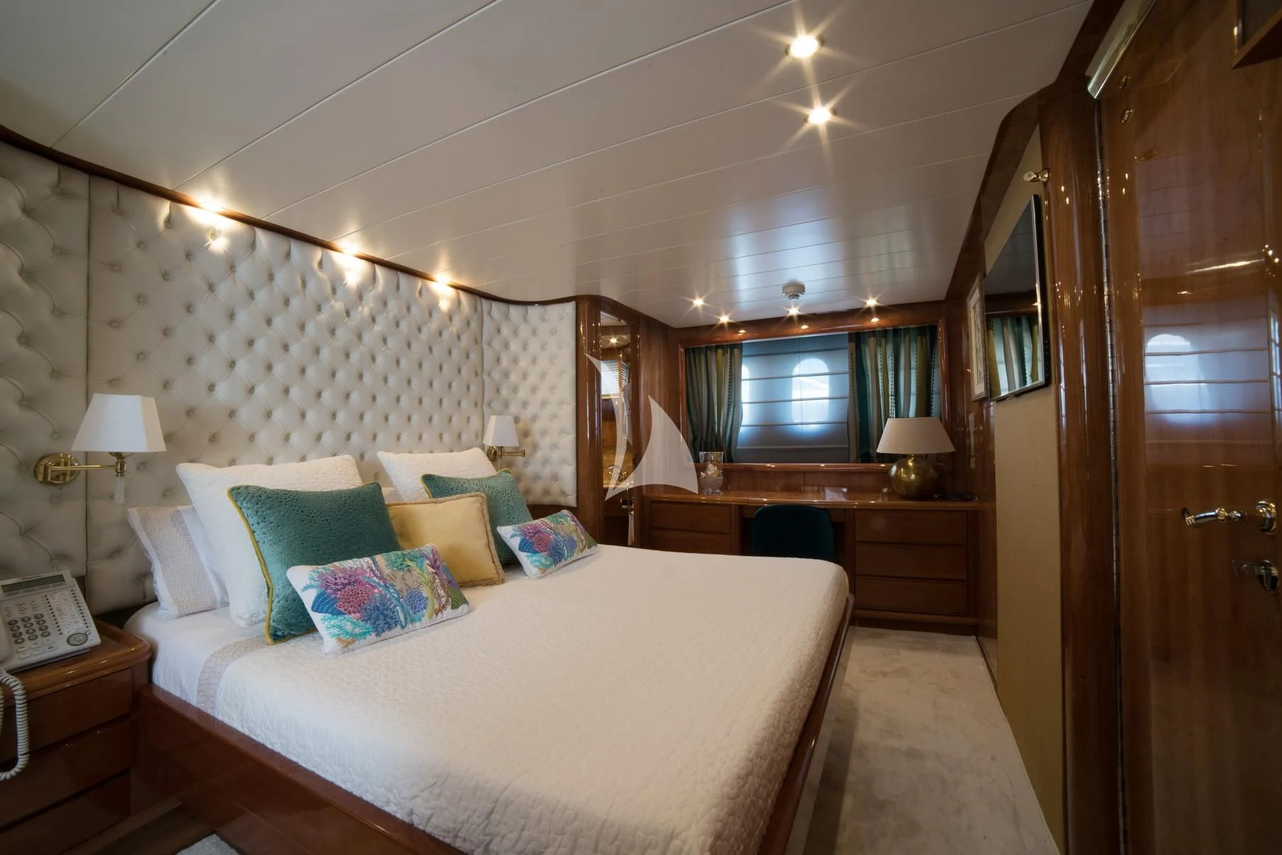 a bedroom with a bed and a desk aboard D'ARISTOTELIS Yacht for Sale