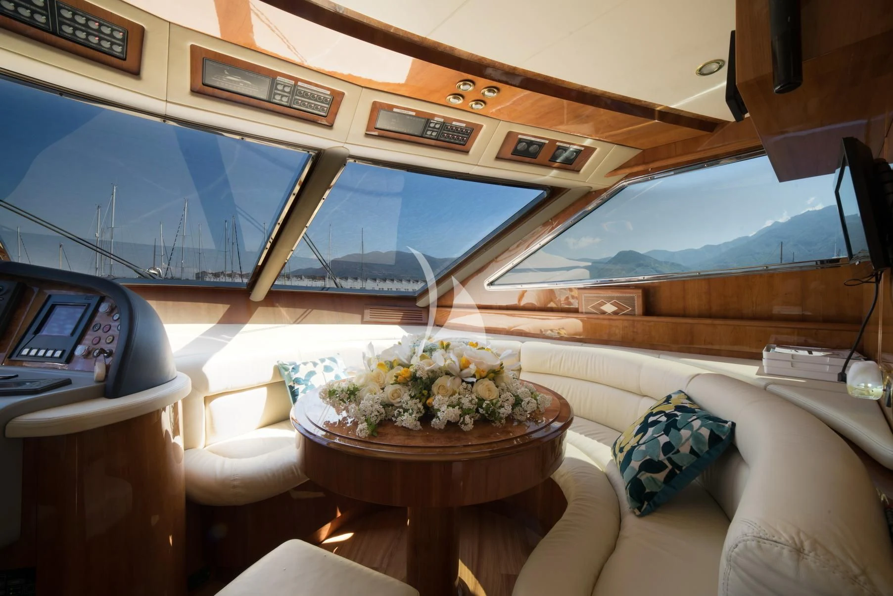a room with a table and a couch aboard D'ARISTOTELIS Yacht for Sale