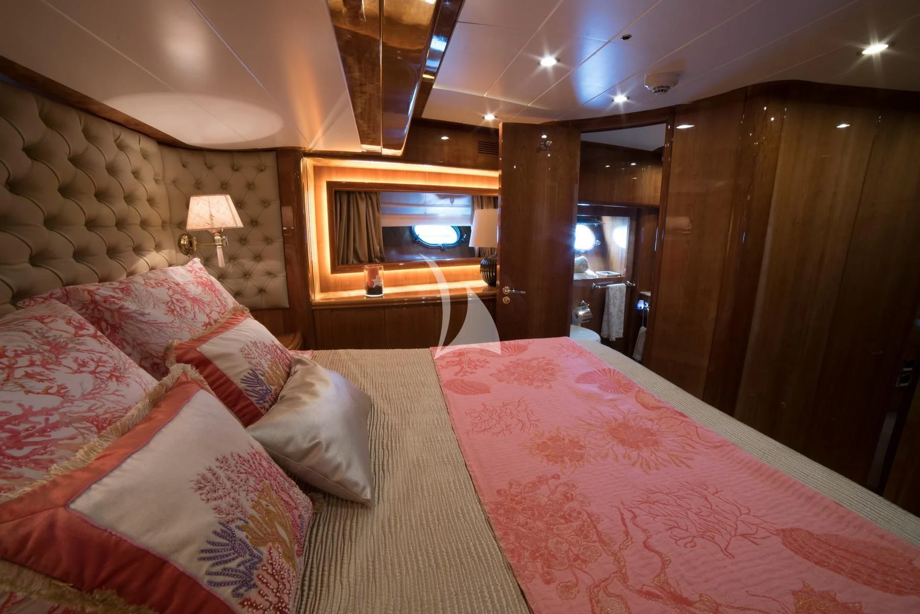 a bed with pink sheets aboard D'ARISTOTELIS Yacht for Sale