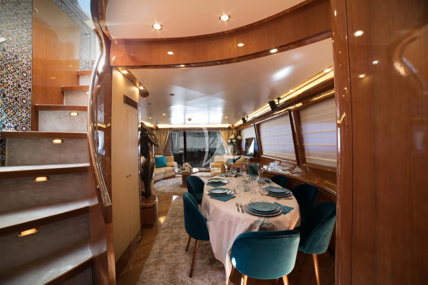 a dining room with a table and chairs aboard D'ARISTOTELIS Yacht for Sale
