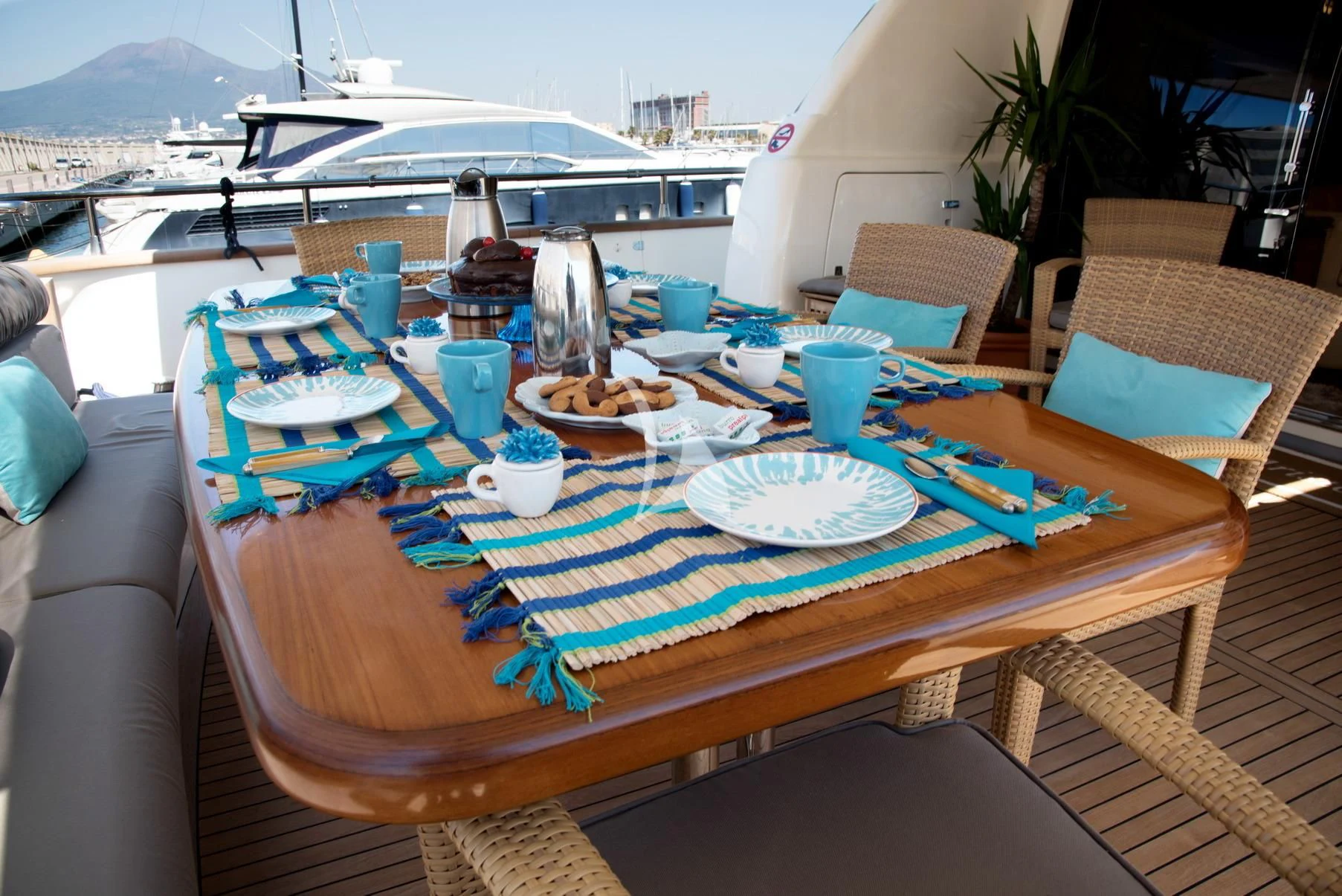 a table with plates and cups on it aboard D'ARISTOTELIS Yacht for Sale