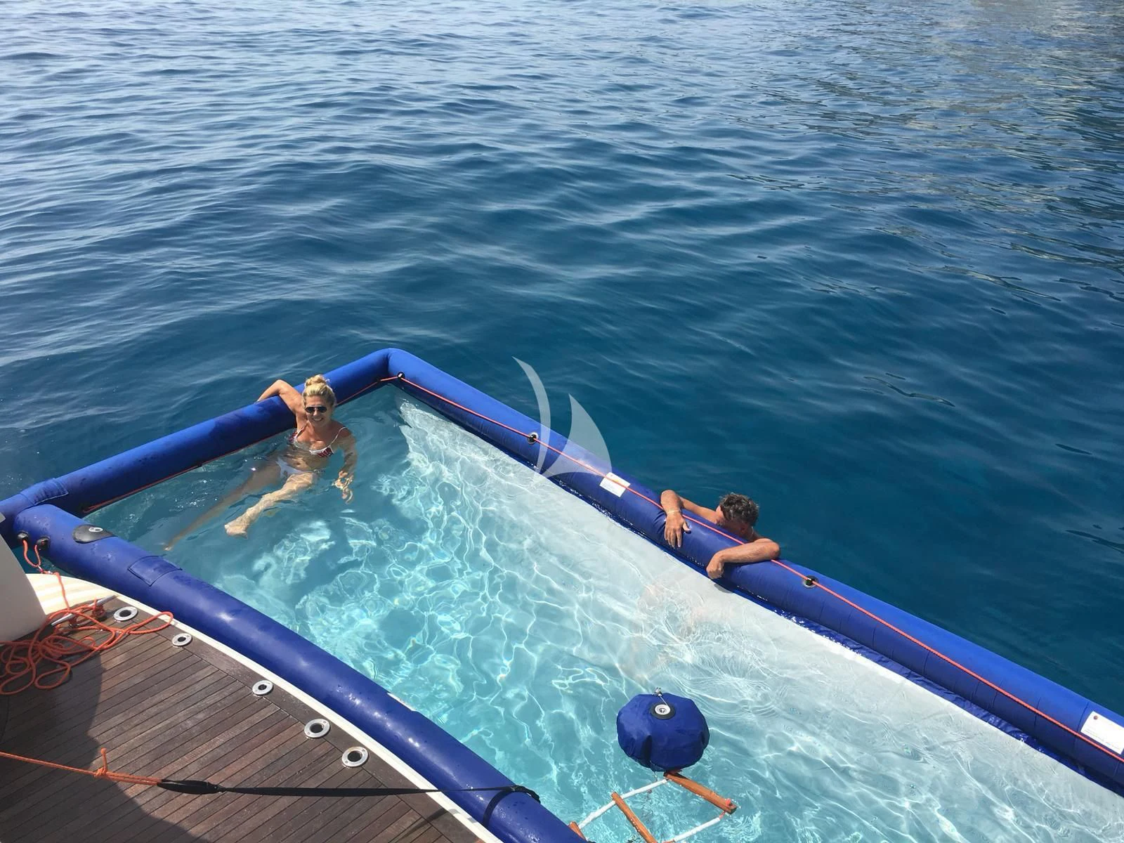 a group of people in a tube in the water aboard D'ARISTOTELIS Yacht for Sale