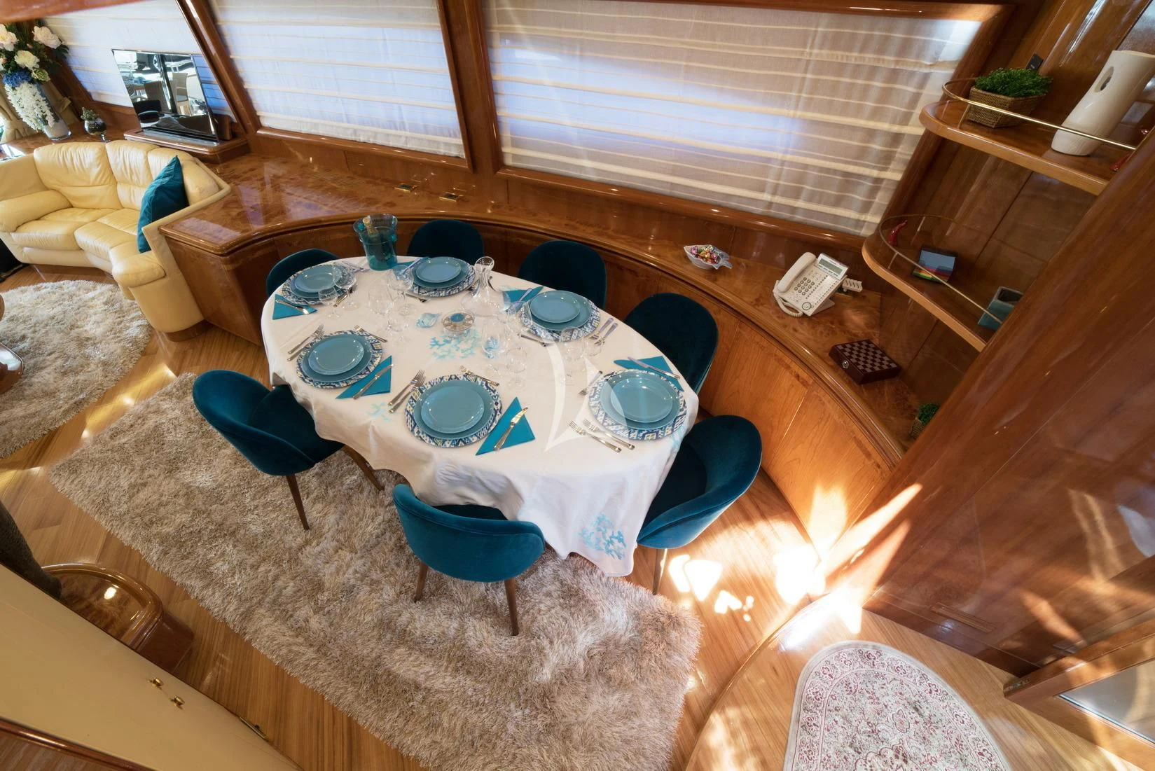 a table with plates and chairs aboard D'ARISTOTELIS Yacht for Sale