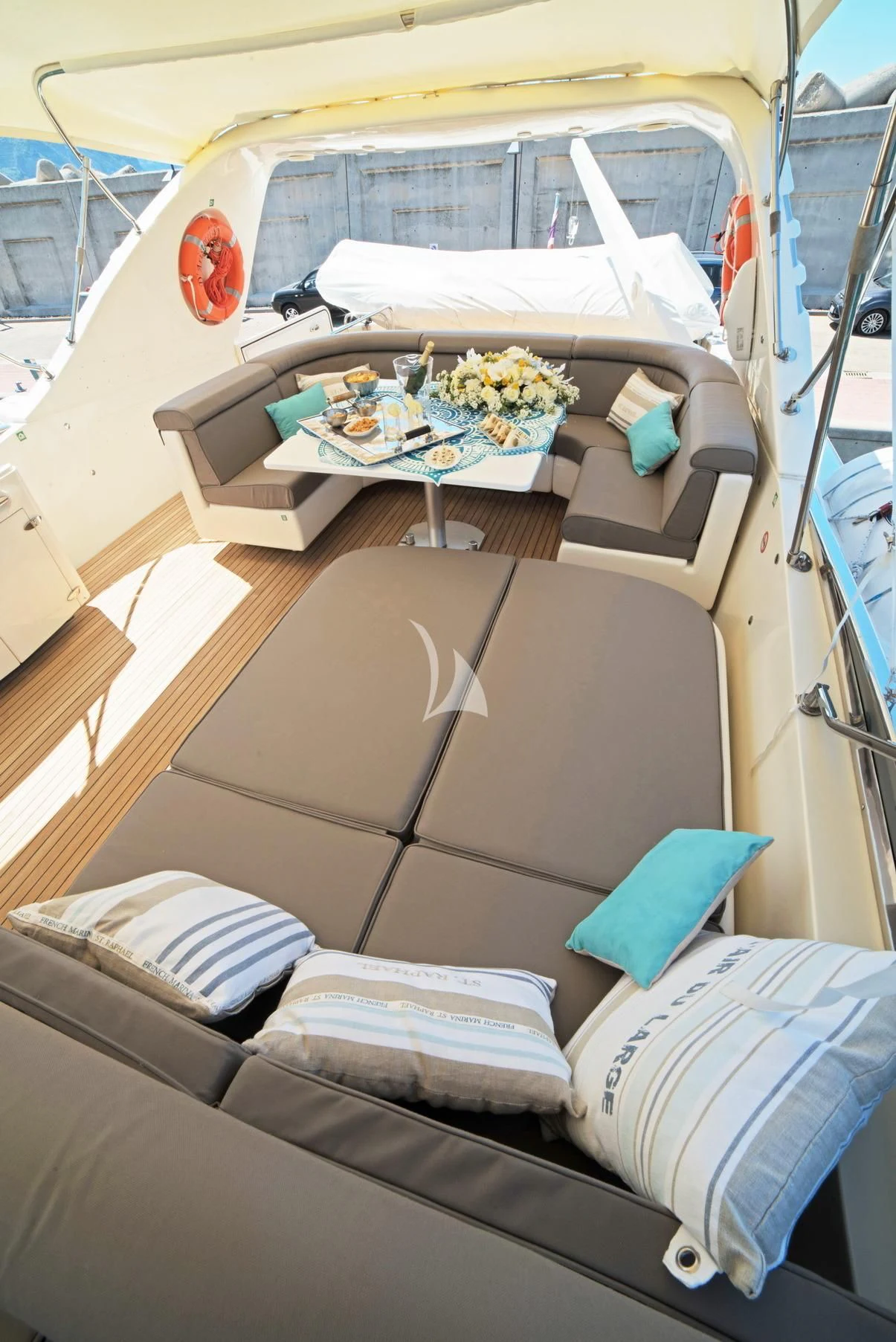 a car with a table and a tray of food on the table aboard D'ARISTOTELIS Yacht for Sale