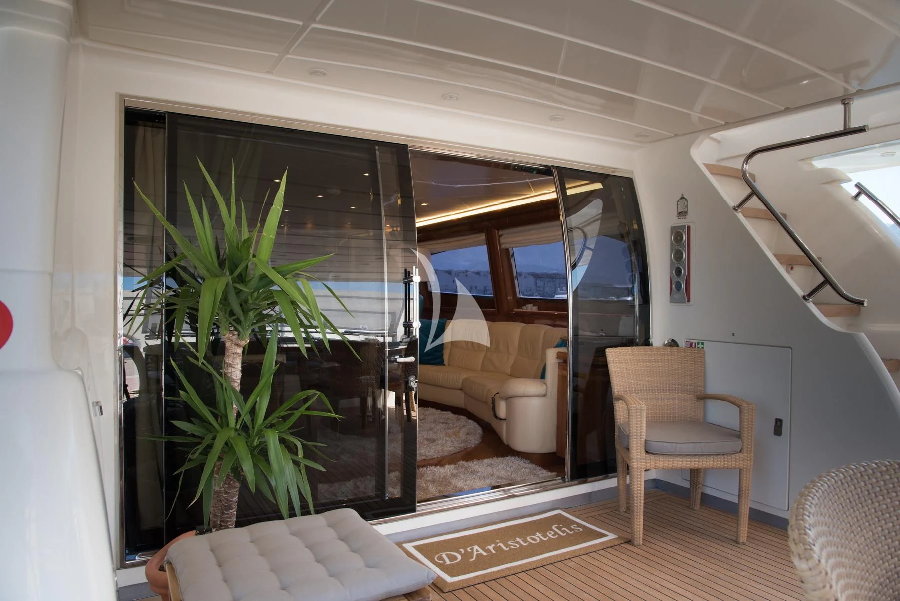 a room with a plant and chairs aboard D'ARISTOTELIS Yacht for Sale