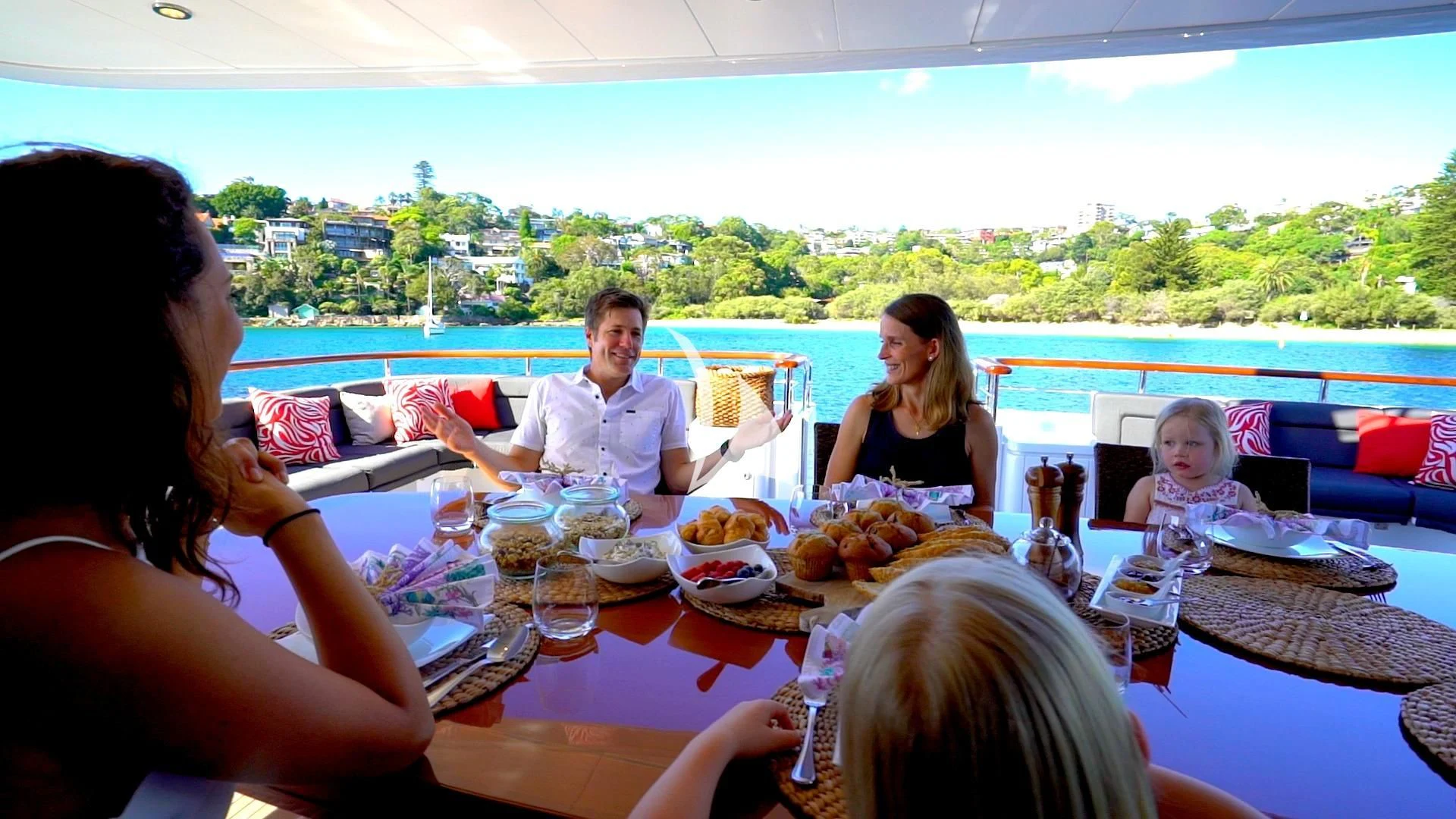 a family sitting at a table aboard MASTEKA 2 Yacht for Charter