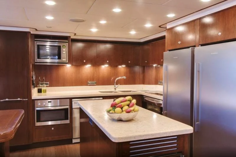a kitchen with a stainless steel refrigerator aboard MASTEKA 2 Yacht for Charter