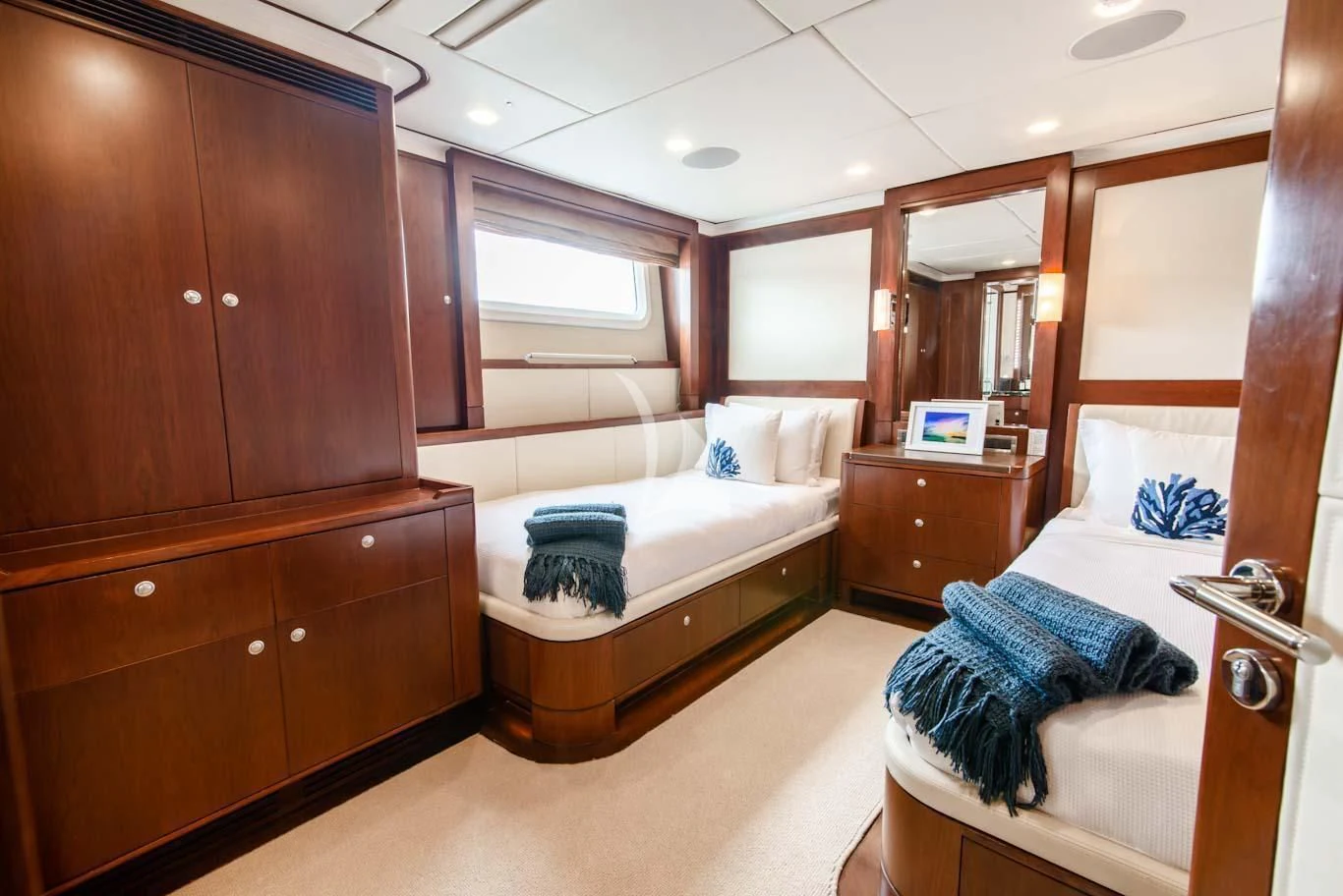 a room with a bed and a dresser aboard MASTEKA 2 Yacht for Charter