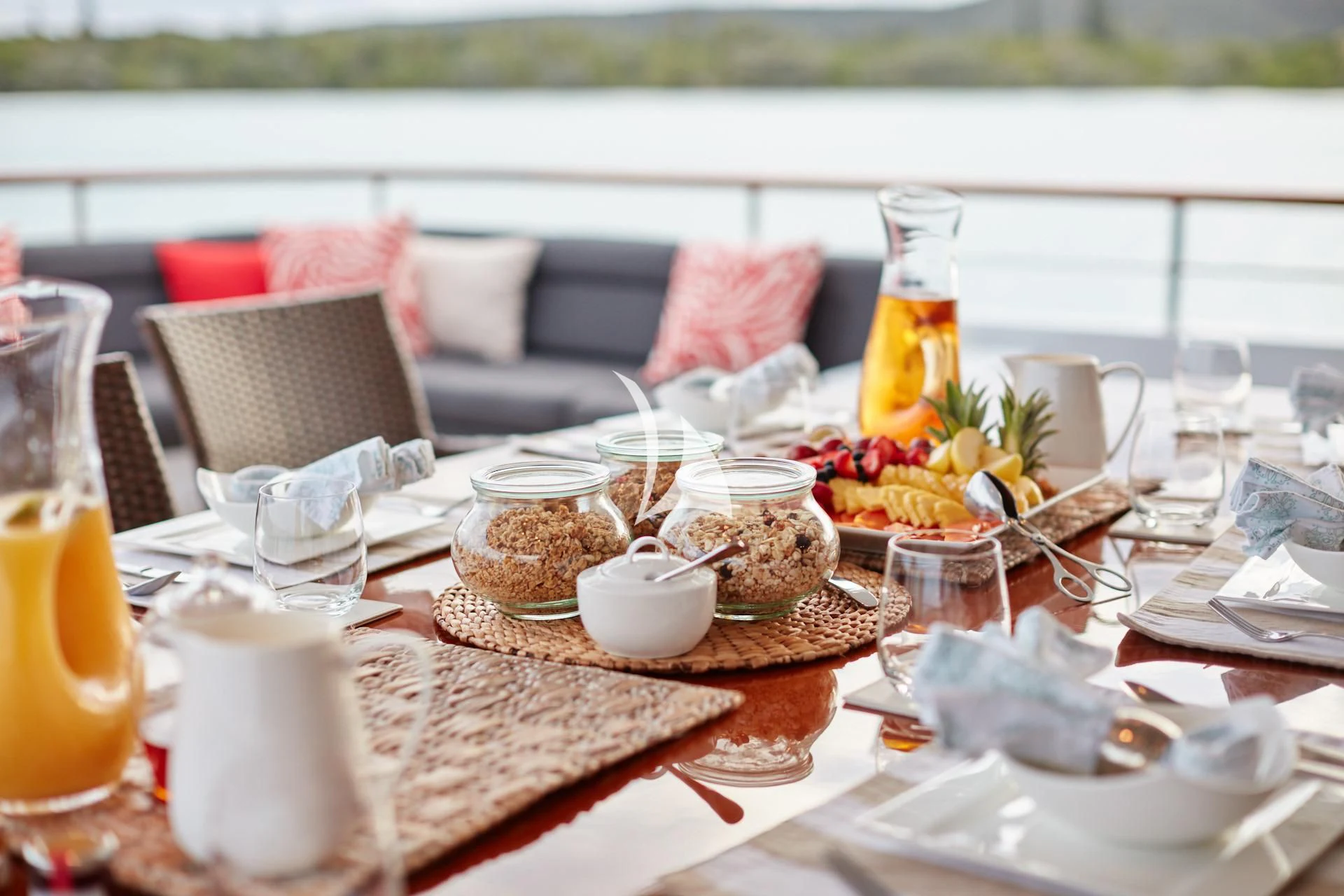 a table with food and drinks on it aboard MASTEKA 2 Yacht for Charter
