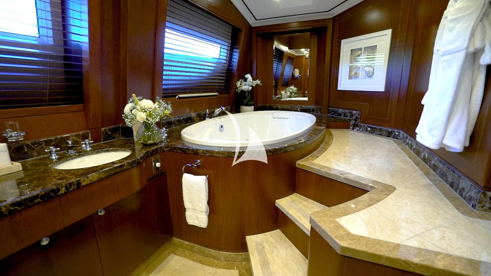 a bathroom with a countertop sink and a mirror aboard MASTEKA 2 Yacht for Charter