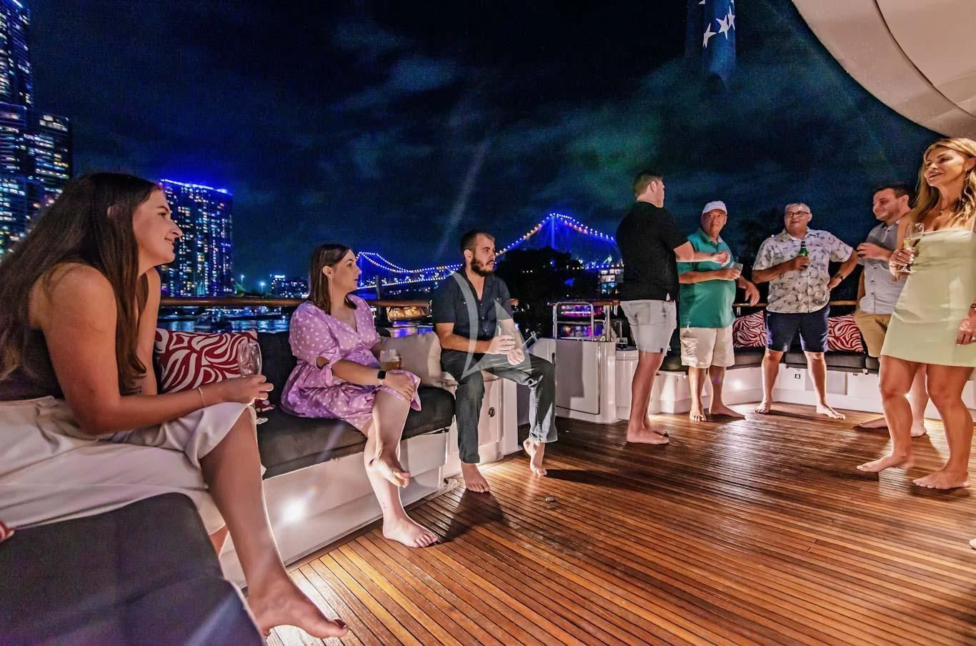 a group of people on a stage aboard MASTEKA 2 Yacht for Charter