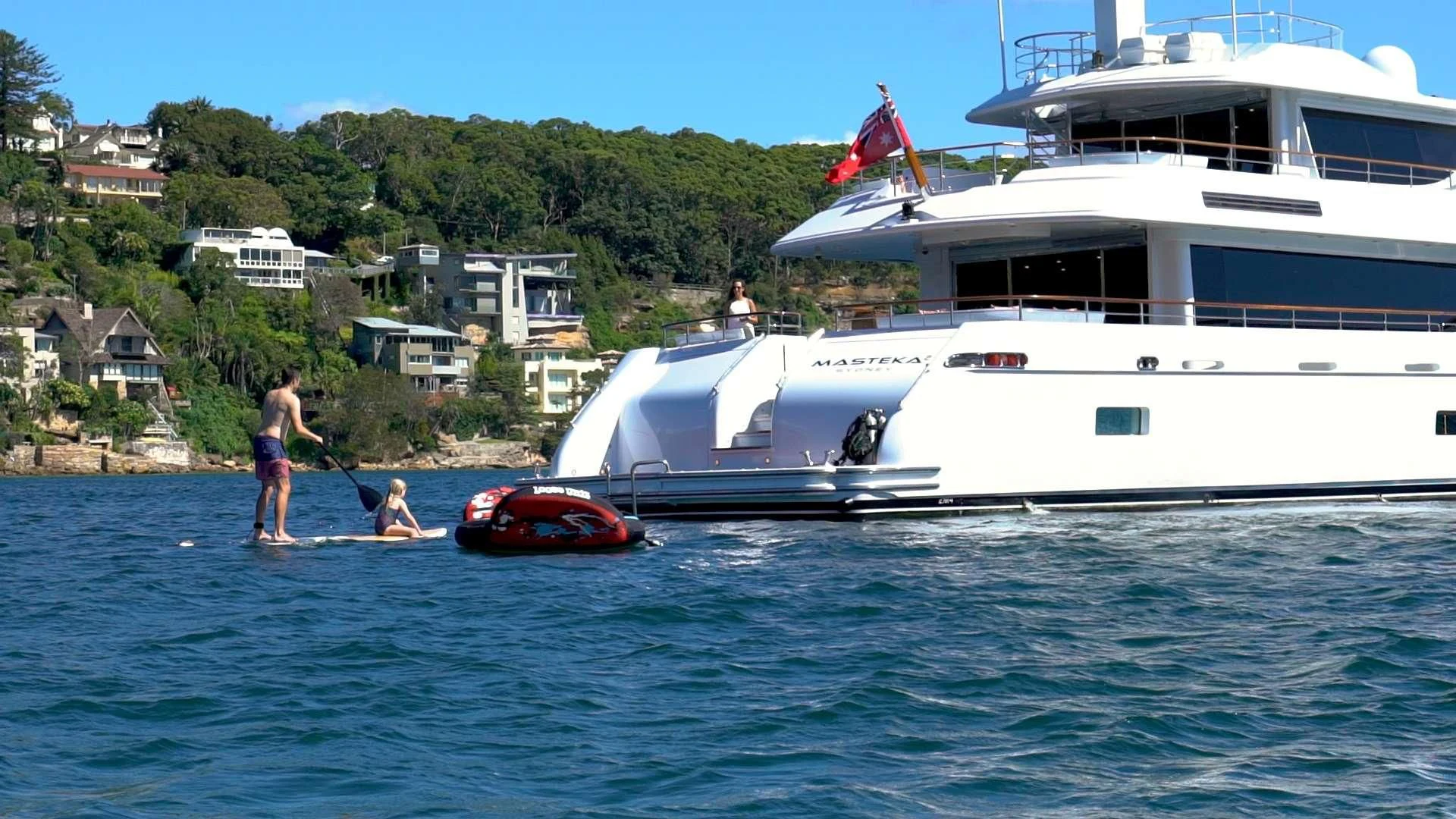 a boat and a couple of people on the water aboard MASTEKA 2 Yacht for Charter