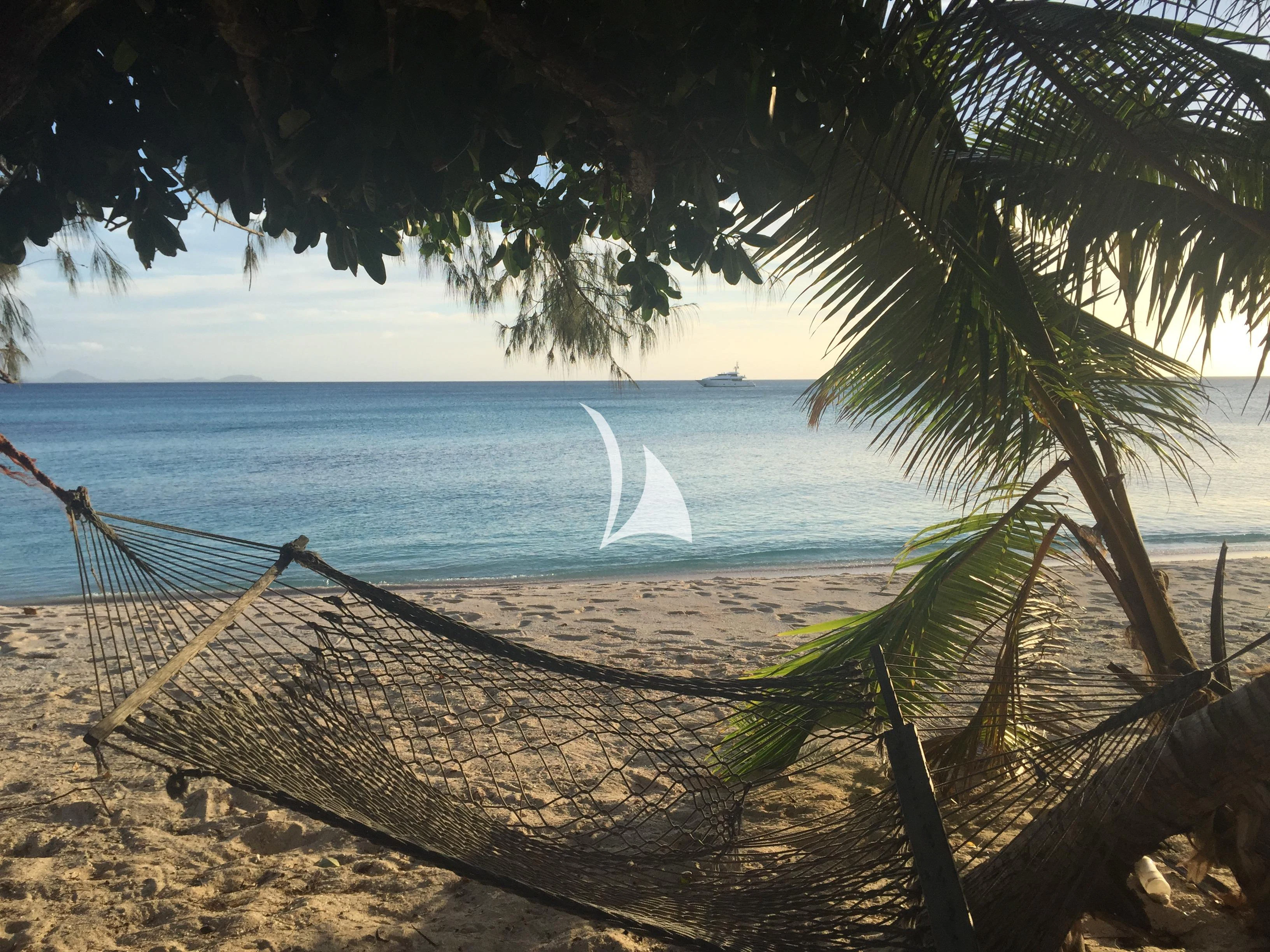 a hammock on a beach aboard MASTEKA 2 Yacht for Charter