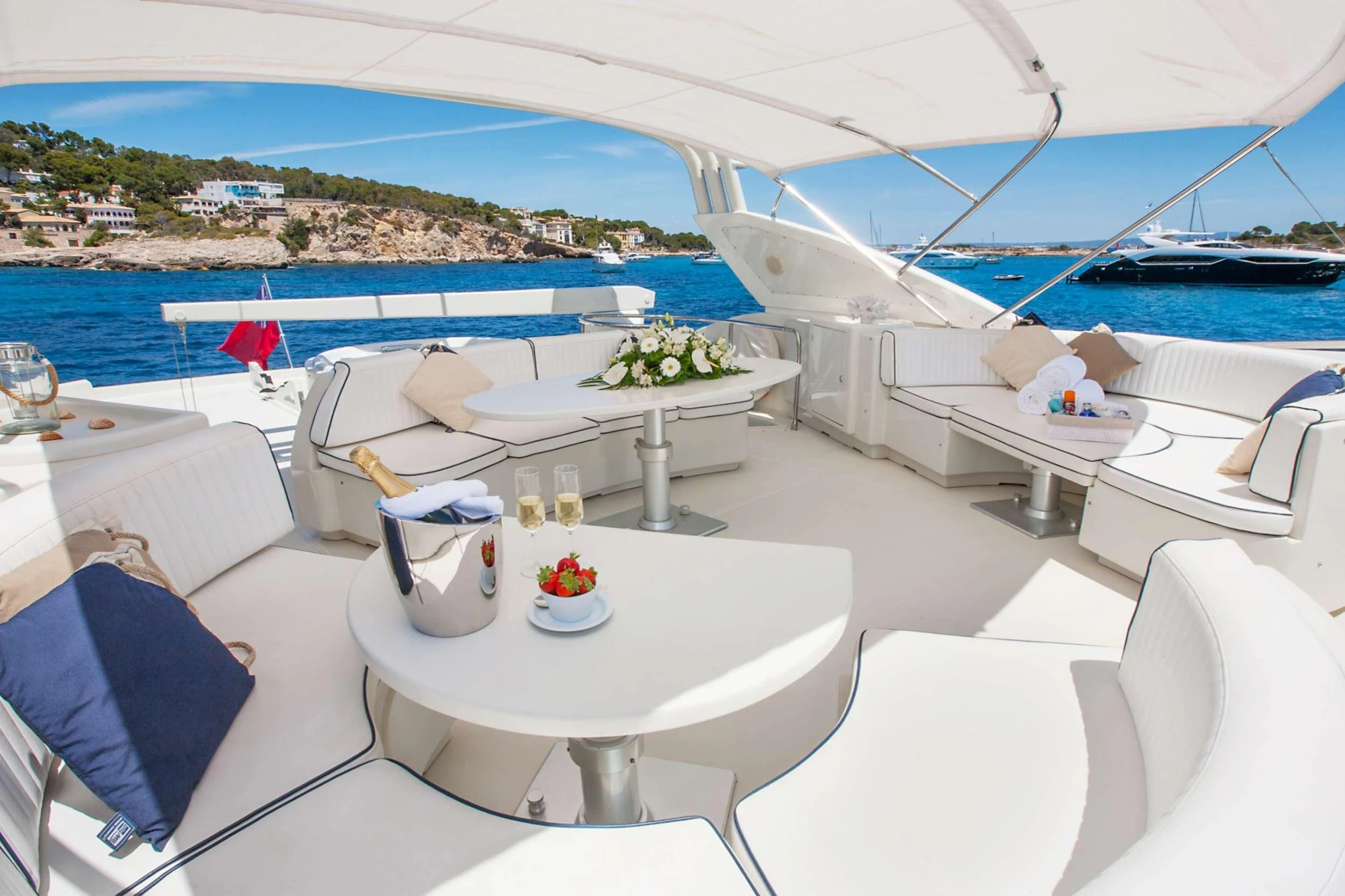 a white lounge chair on a boat aboard WHITE FANG Yacht for Sale