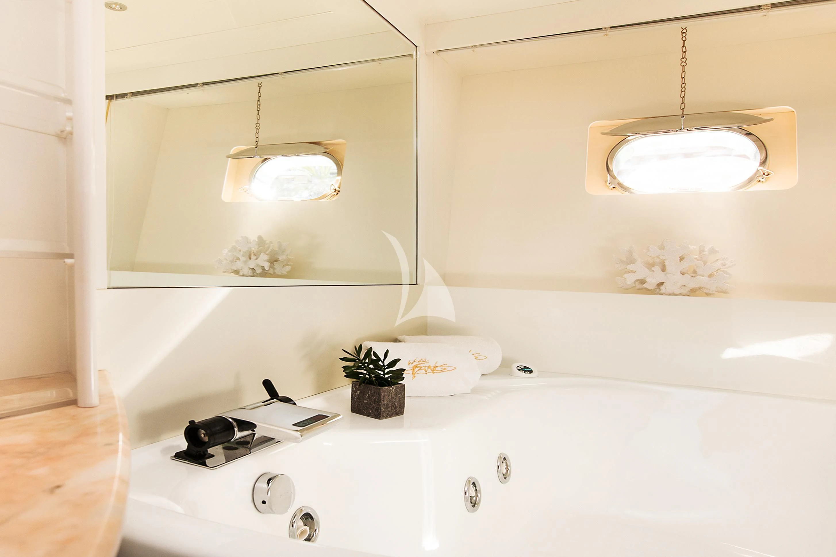 a bathroom with a sink and a mirror aboard WHITE FANG Yacht for Sale