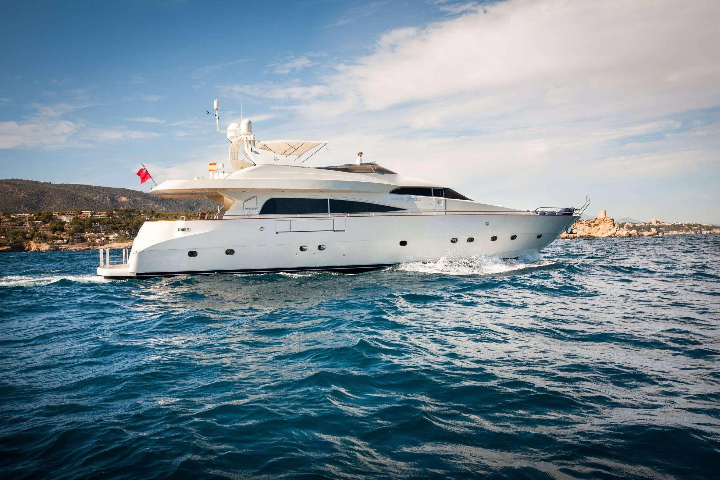 a white yacht in the water aboard WHITE FANG Yacht for Sale