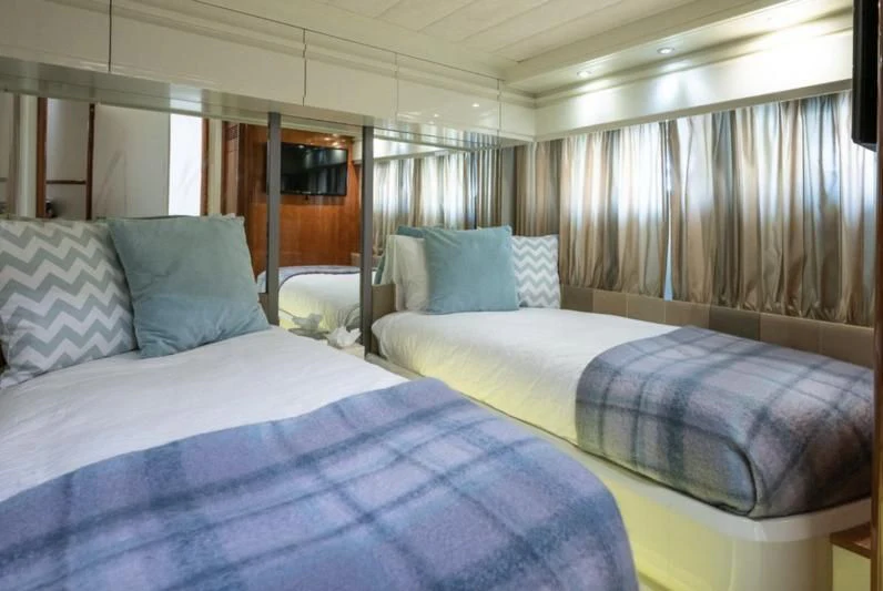 a couple of beds in a room aboard WHITE FANG Yacht for Sale