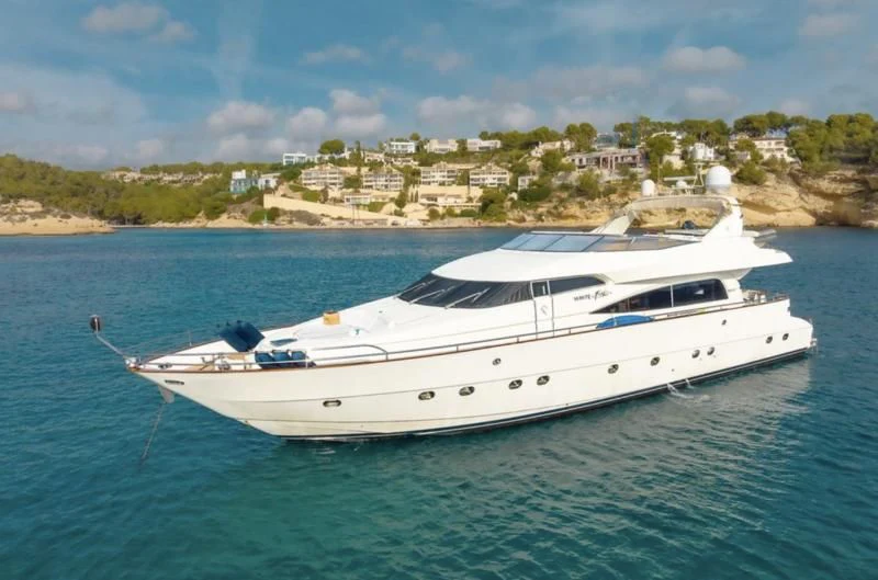 a white yacht in the water aboard WHITE FANG Yacht for Sale