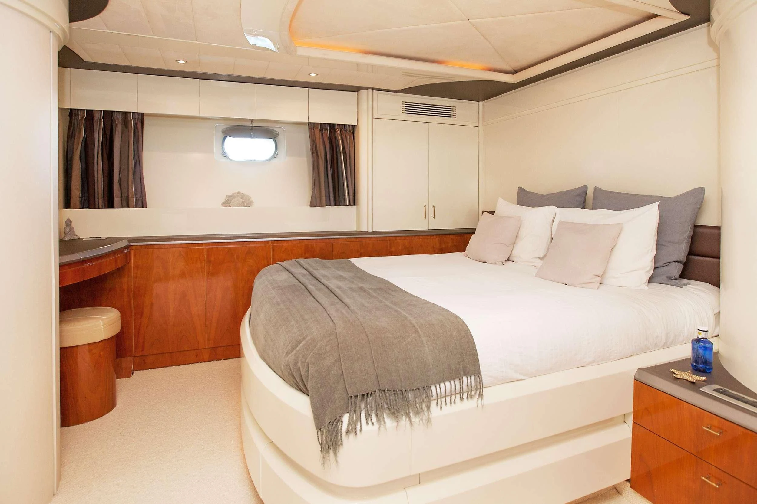a bed with white sheets aboard WHITE FANG Yacht for Sale