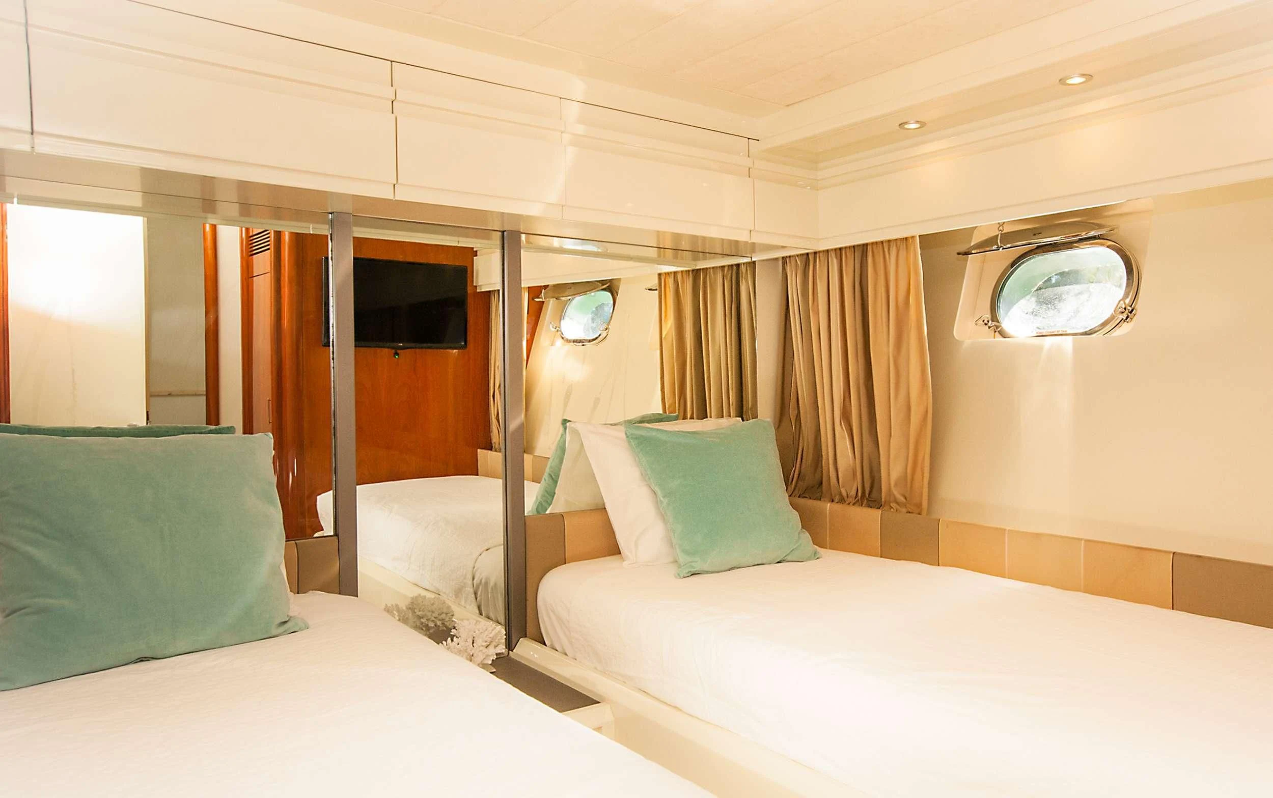 a room with two beds aboard WHITE FANG Yacht for Sale