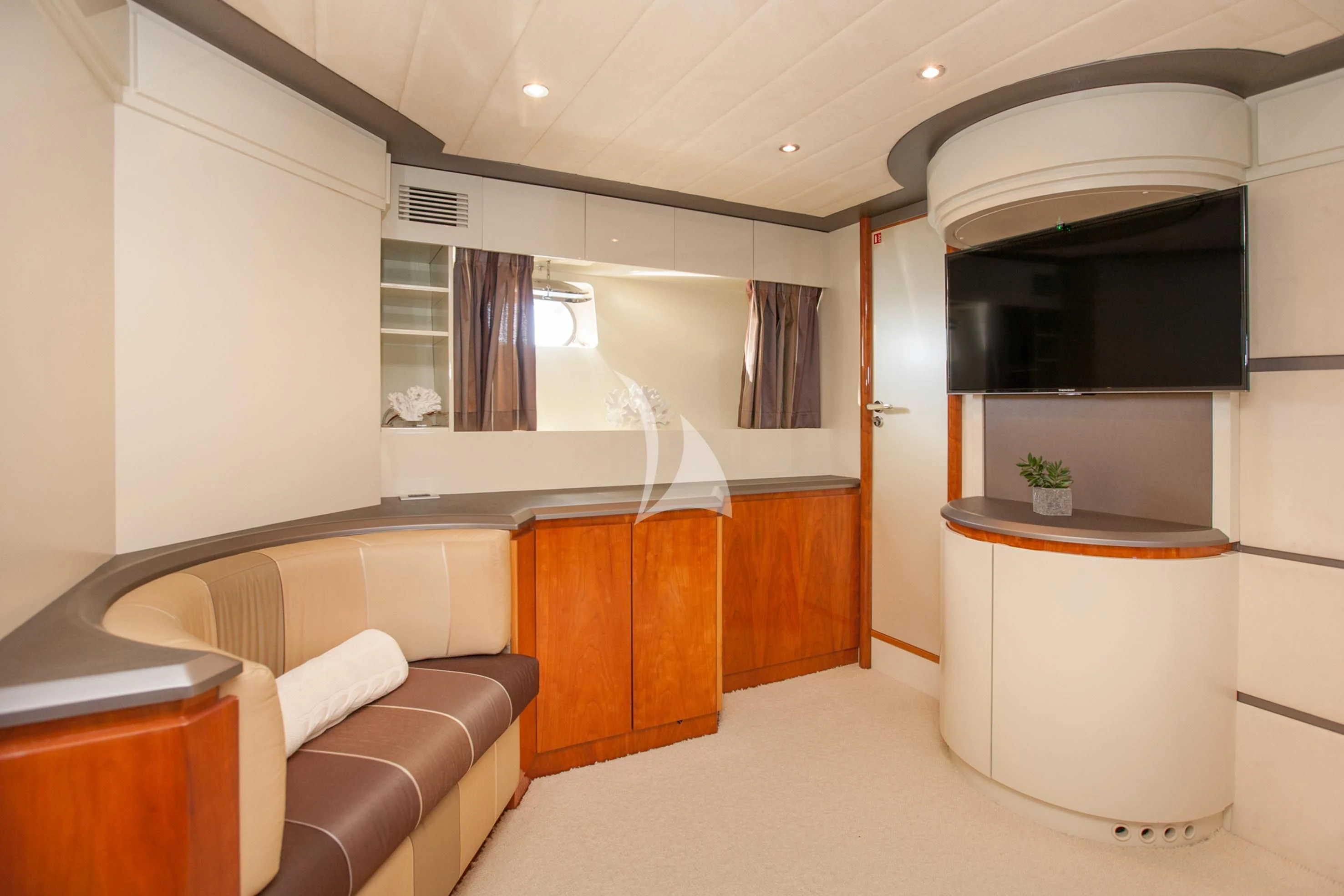 a room with a couch and a table and a television aboard WHITE FANG Yacht for Sale