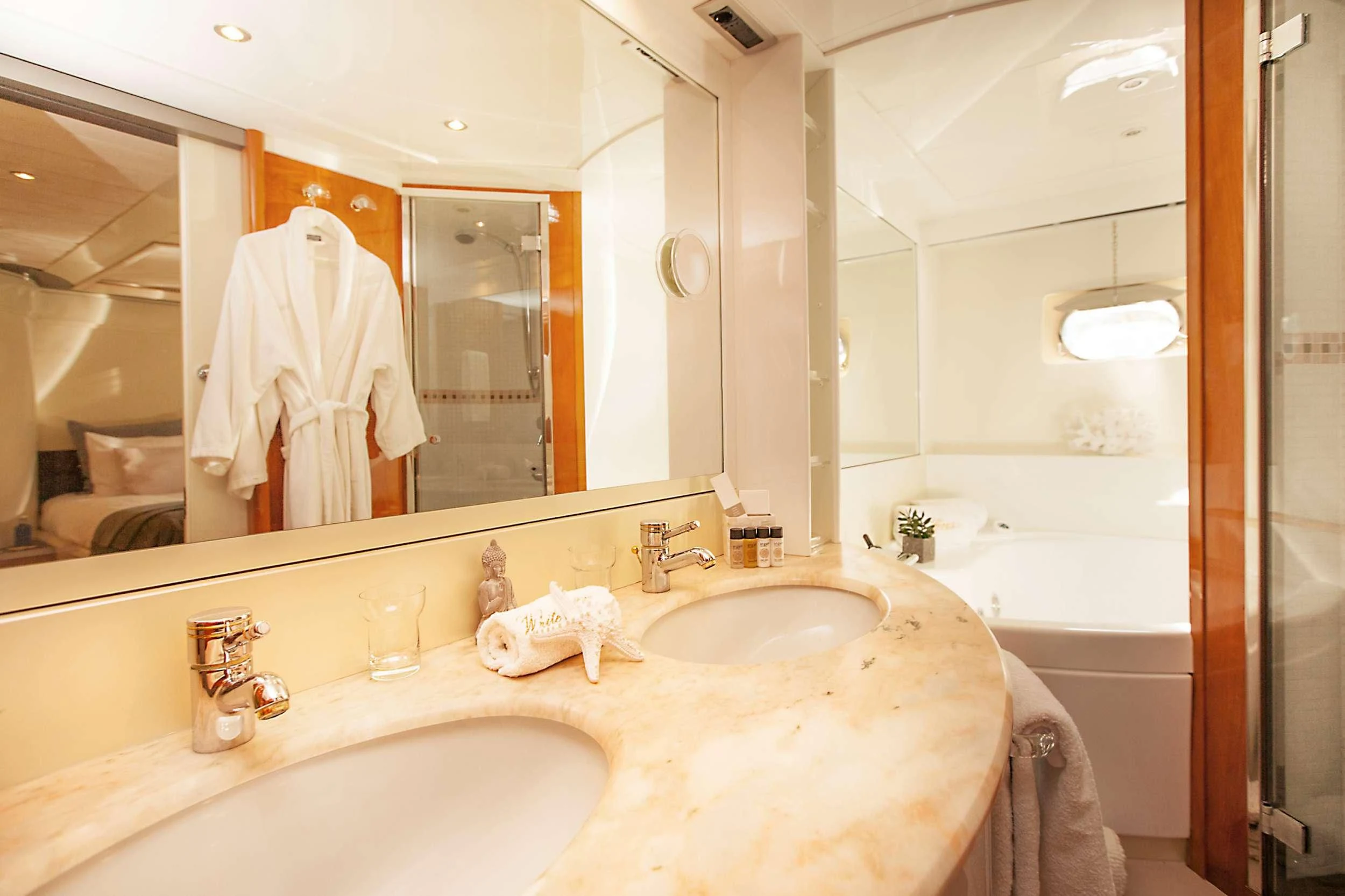 a bathroom with a large mirror aboard WHITE FANG Yacht for Sale