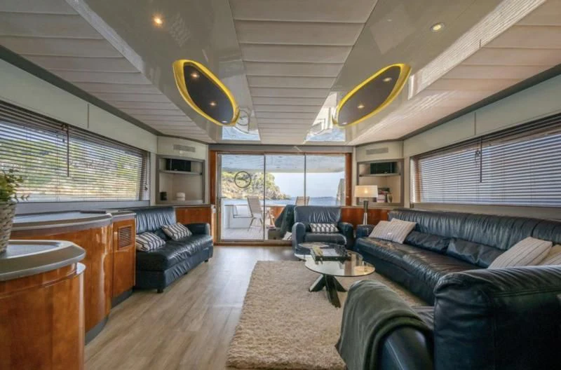 a living room with a large window aboard WHITE FANG Yacht for Sale